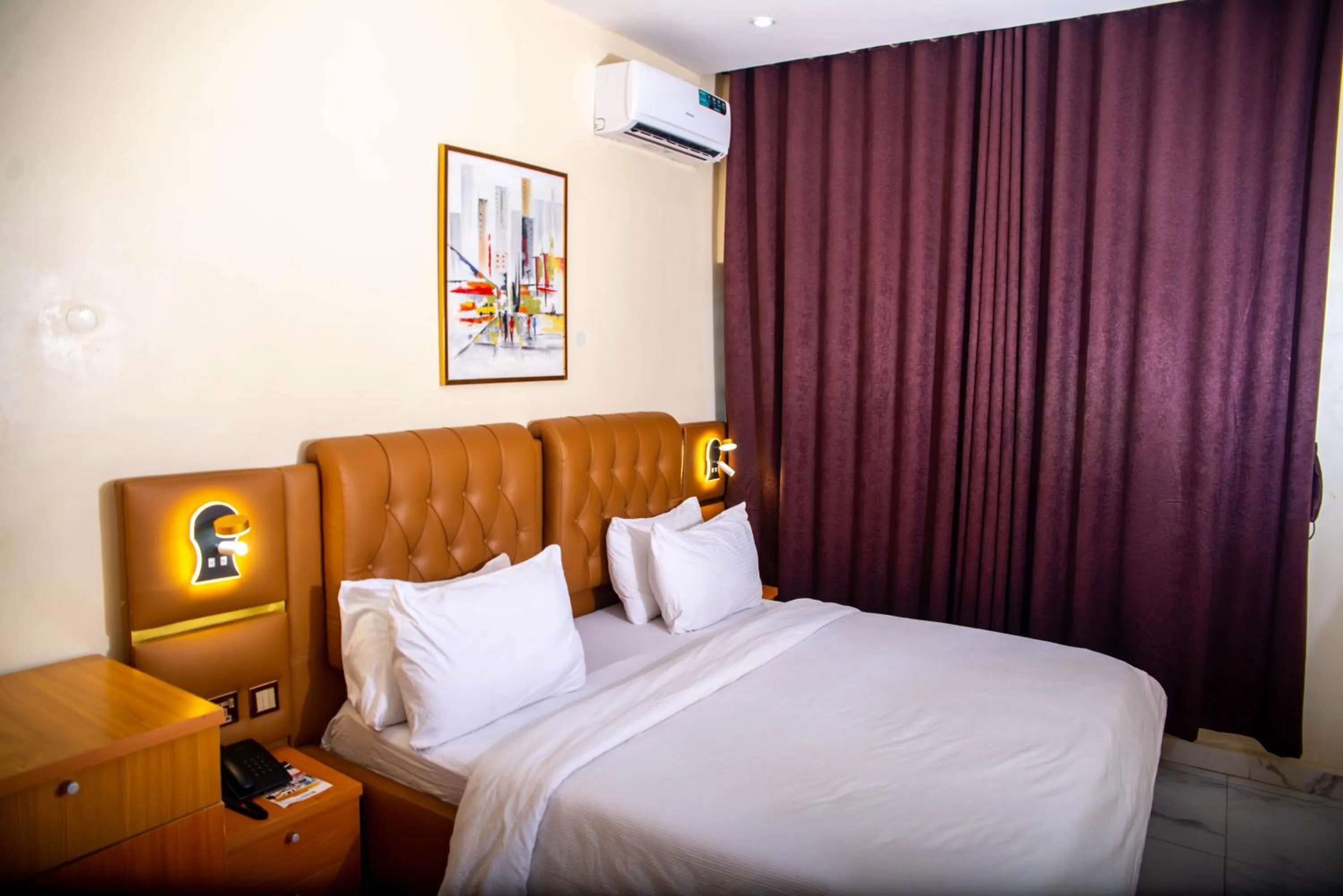 Bed in Buddiez Hotel & Resort