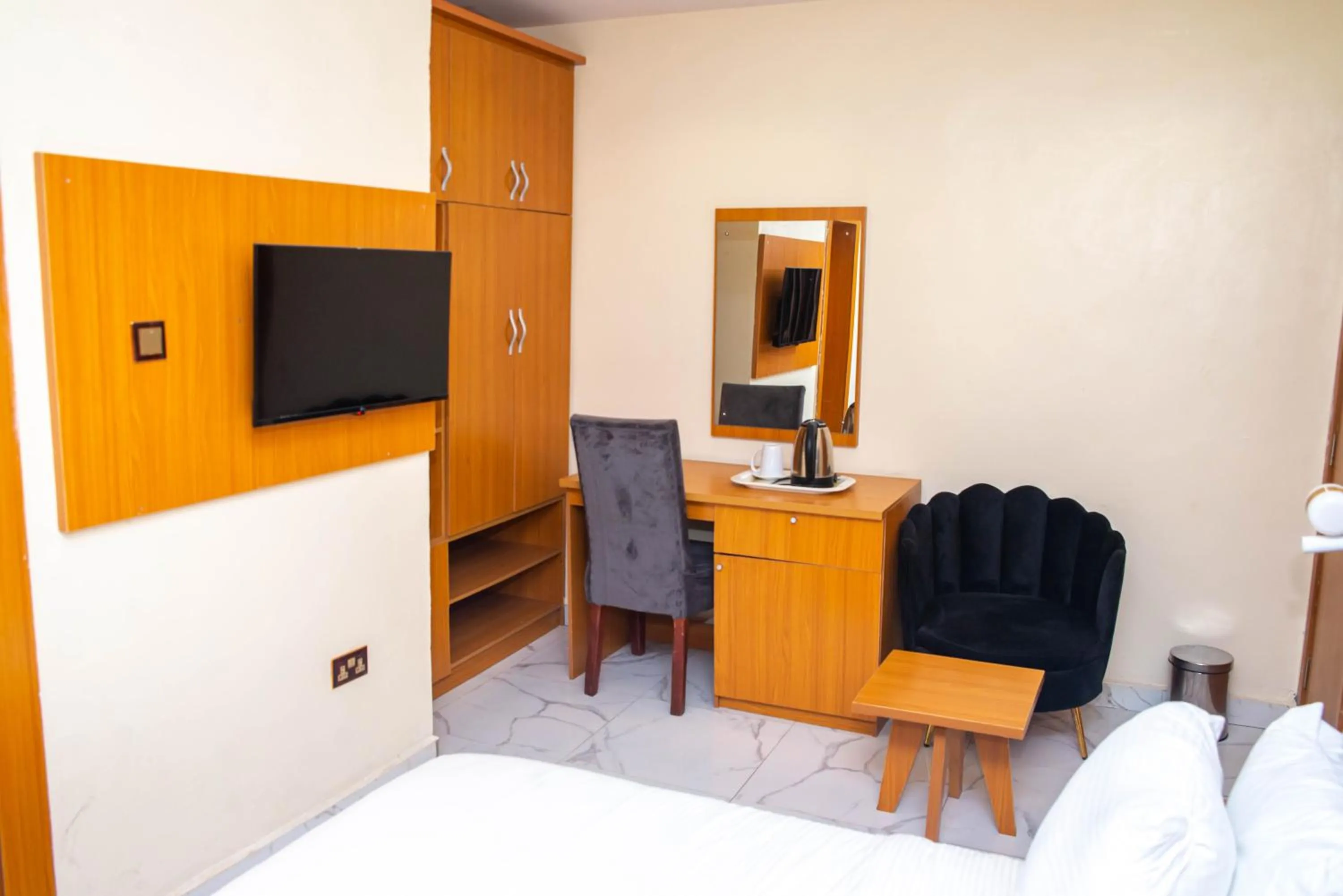 Bed in Buddiez Hotel & Resort