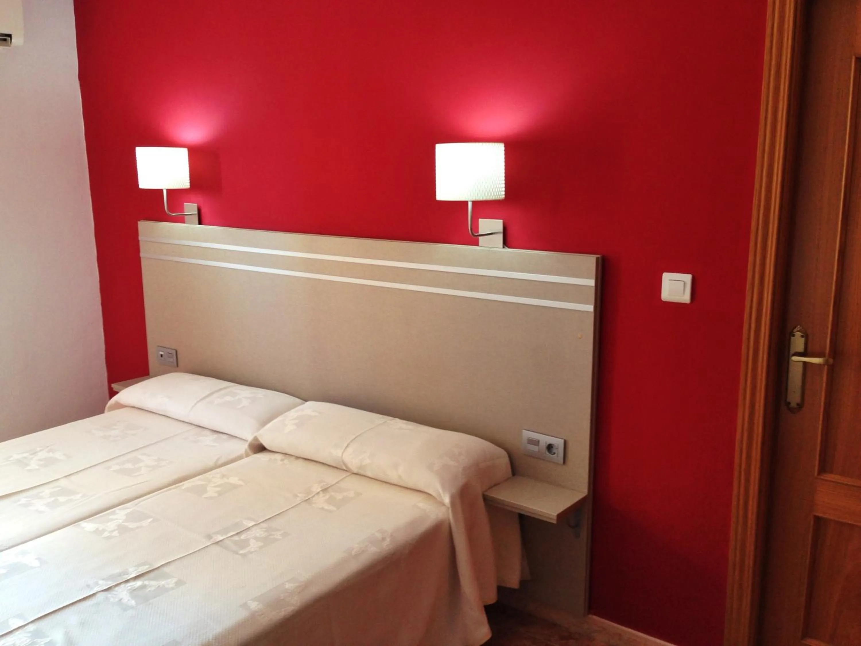 Bed in Hotel Carmen Teresa