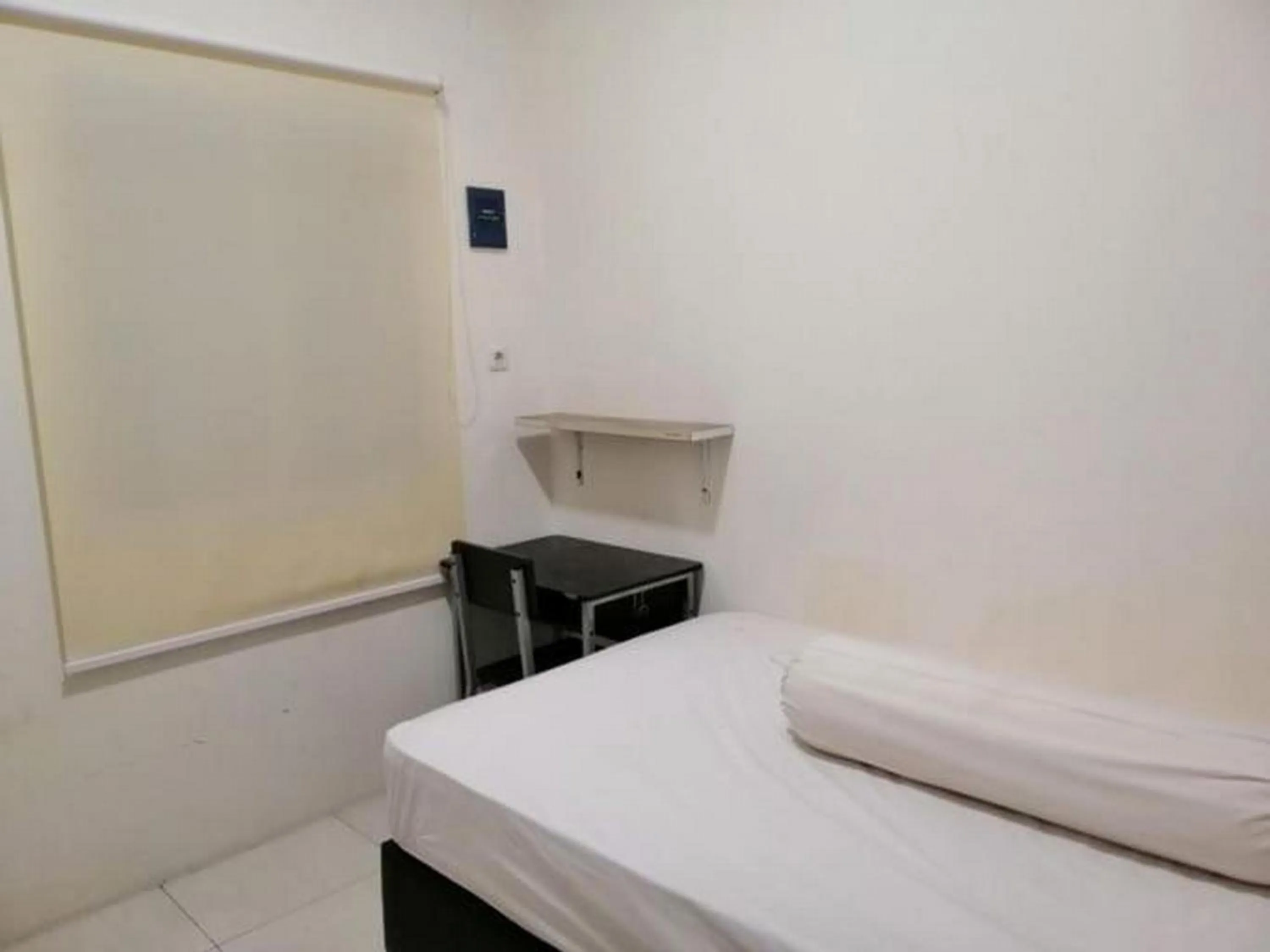 Bedroom in De Homestay Mitra RedDoorz Bitung