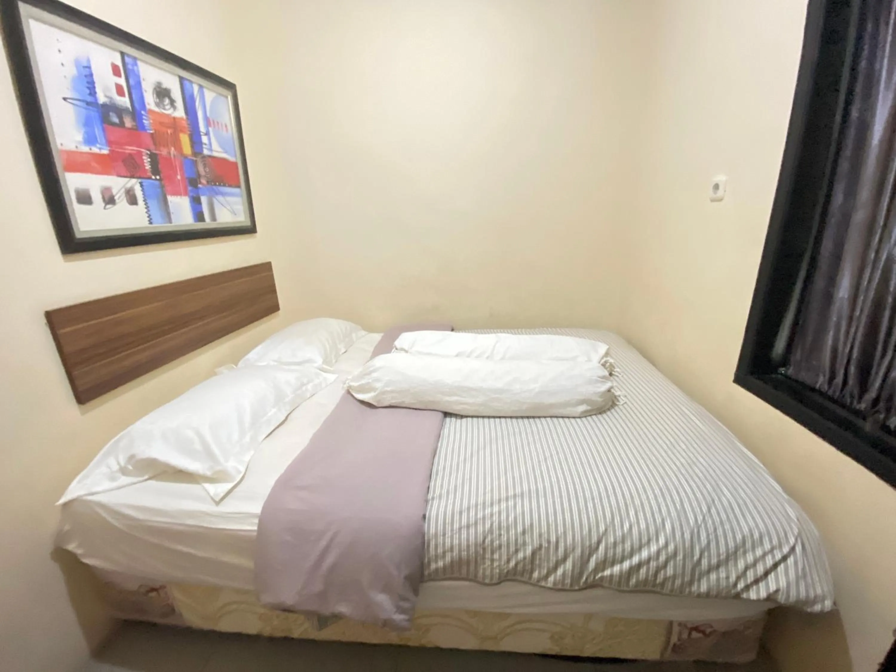 Bedroom in De Homestay Mitra RedDoorz Bitung