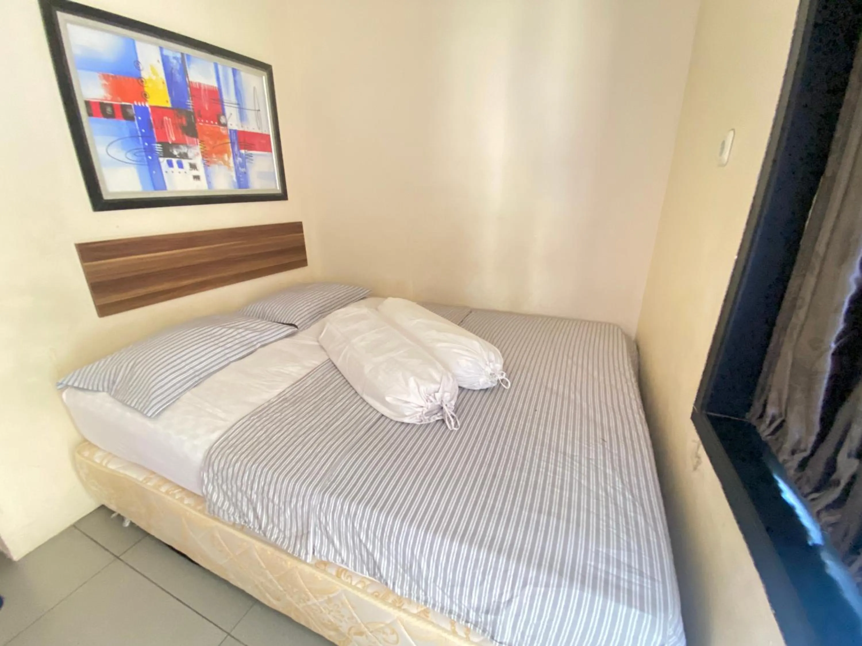 Bedroom in De Homestay Mitra RedDoorz Bitung