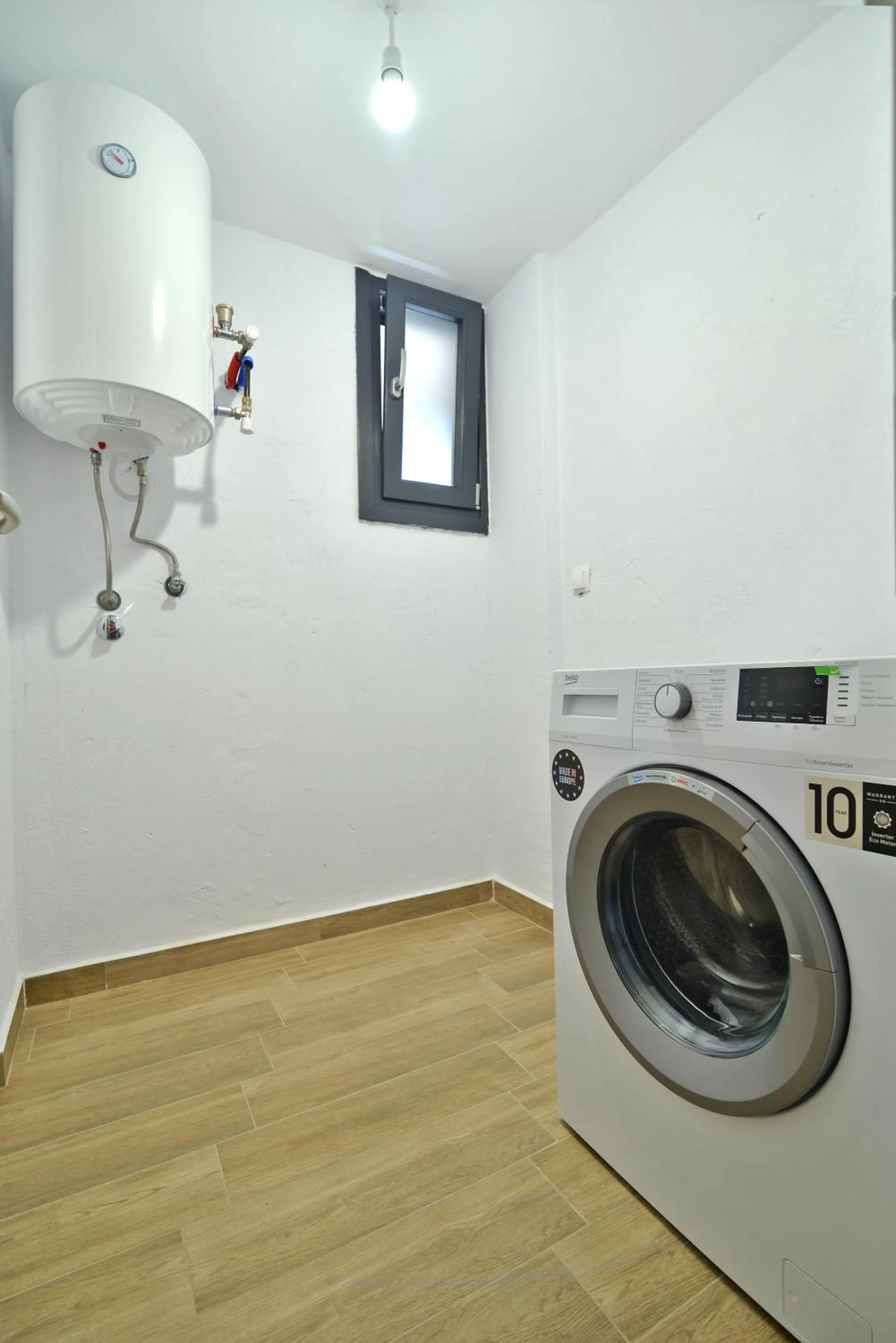washing machine in Niel Holiday Apartments, Panel Hospitality Homes & Villas