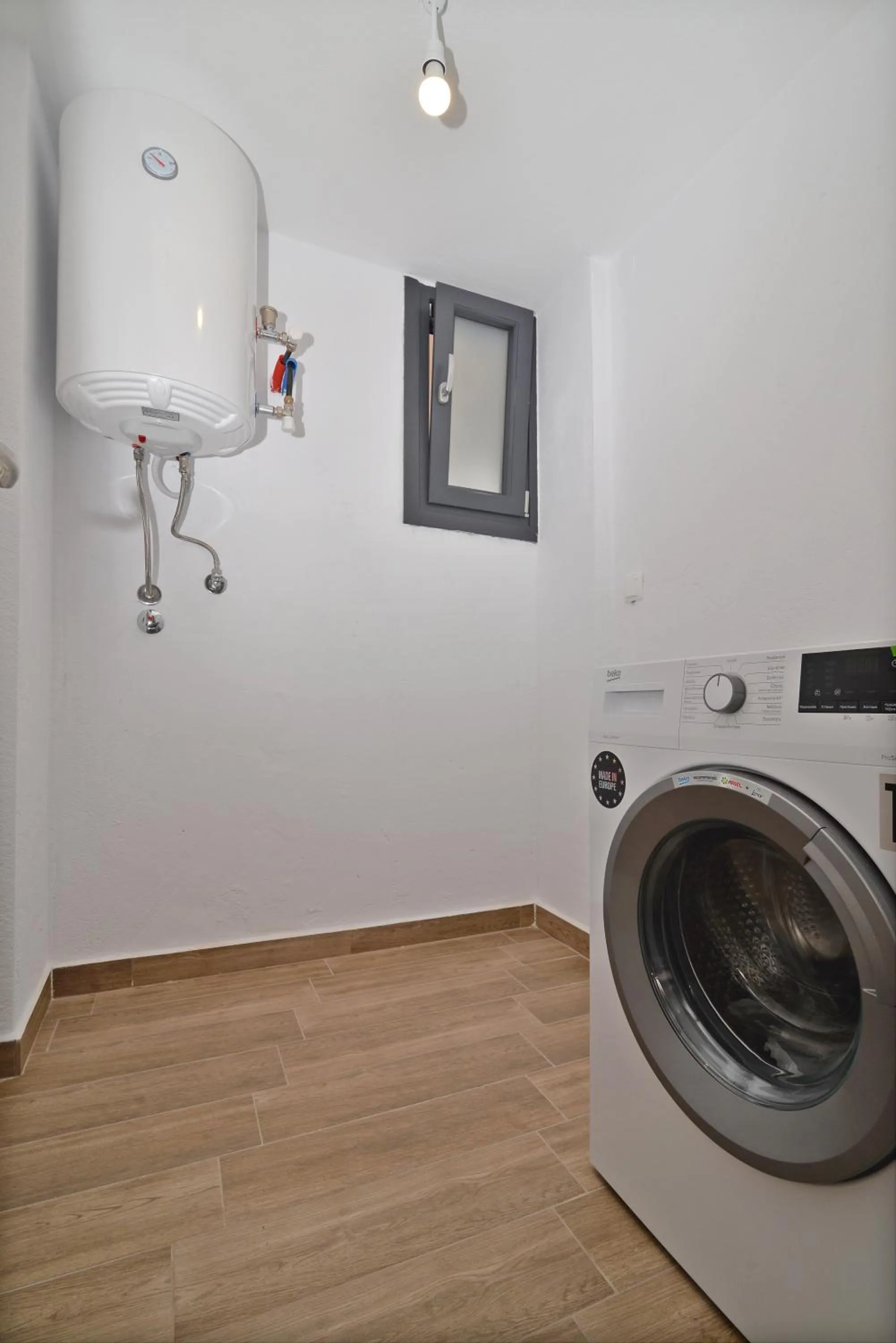 washing machine in Niel Holiday Apartments, Panel Hospitality Homes & Villas