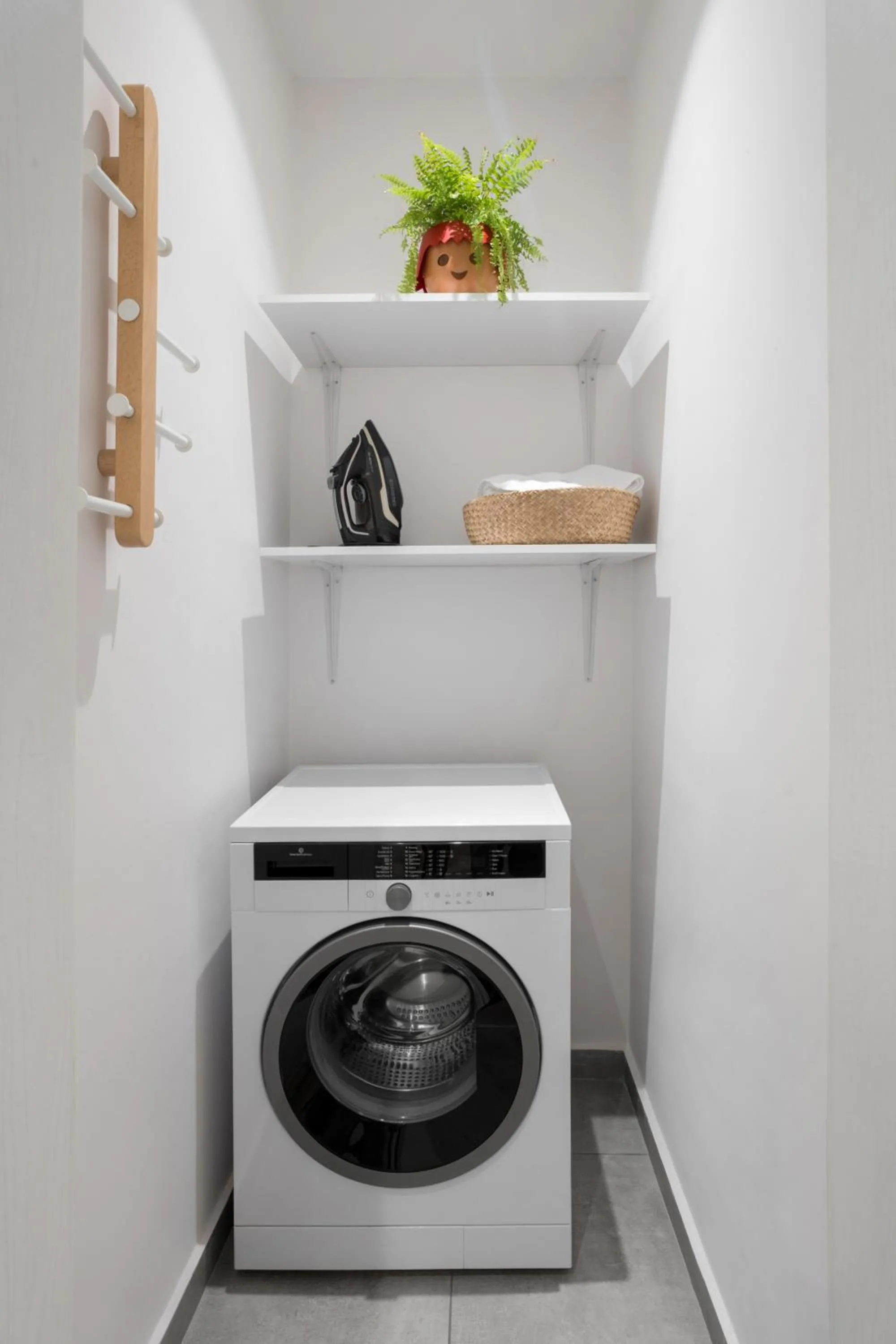 washing machine in The Caravan Apartments