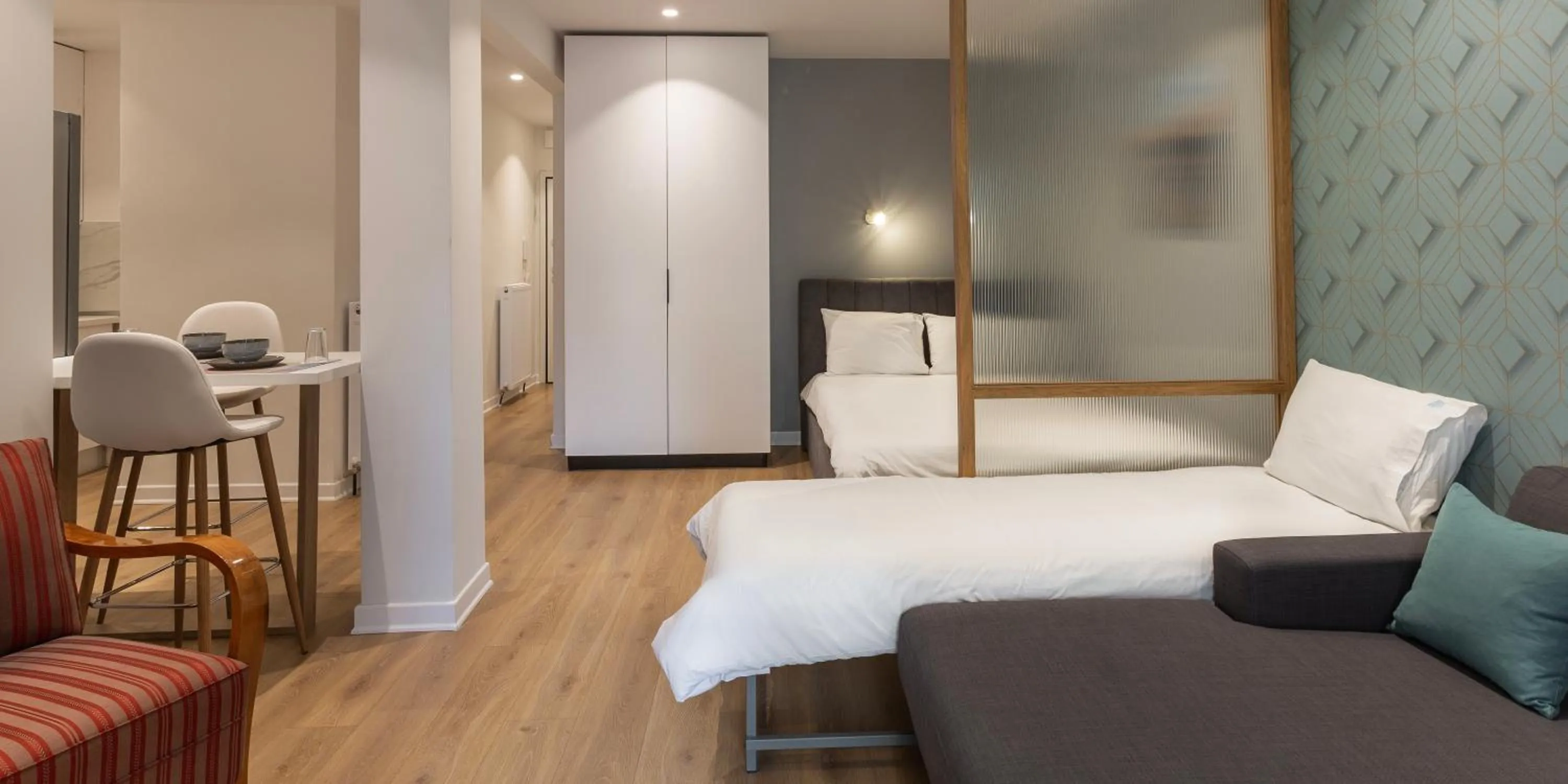 Bed in The Caravan Apartments