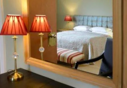 Bed in Mabie House Hotel