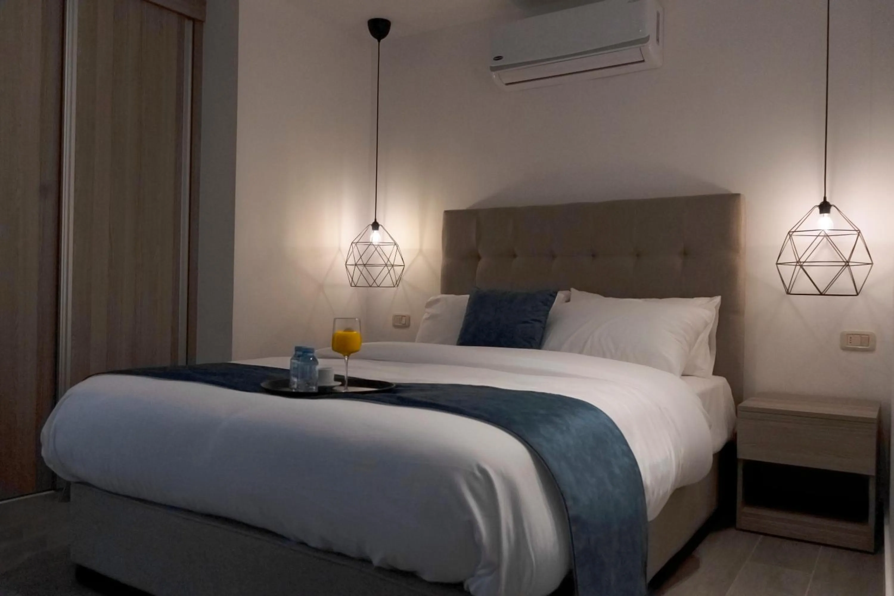 Bed in Red Carpet Hotel & Suites