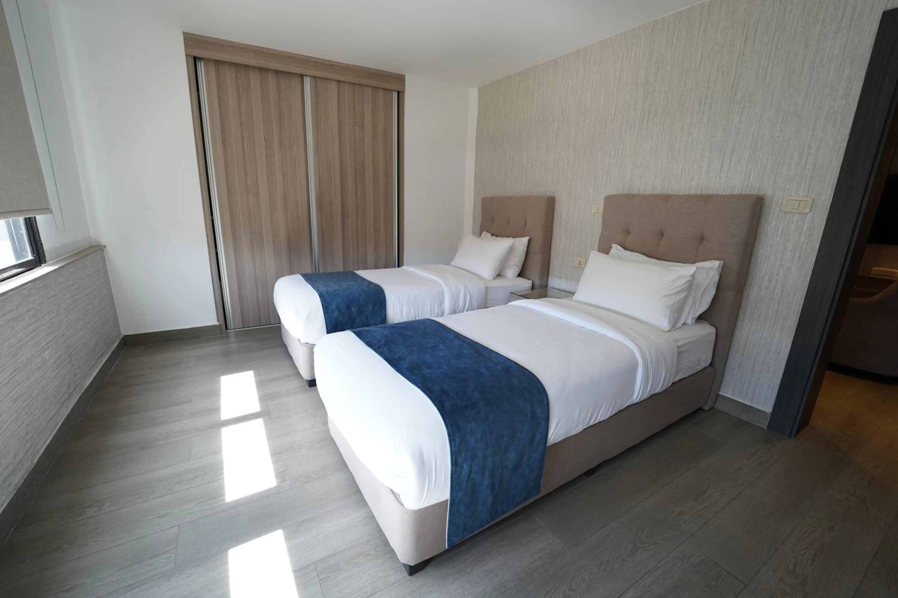 Bed in Red Carpet Hotel & Suites