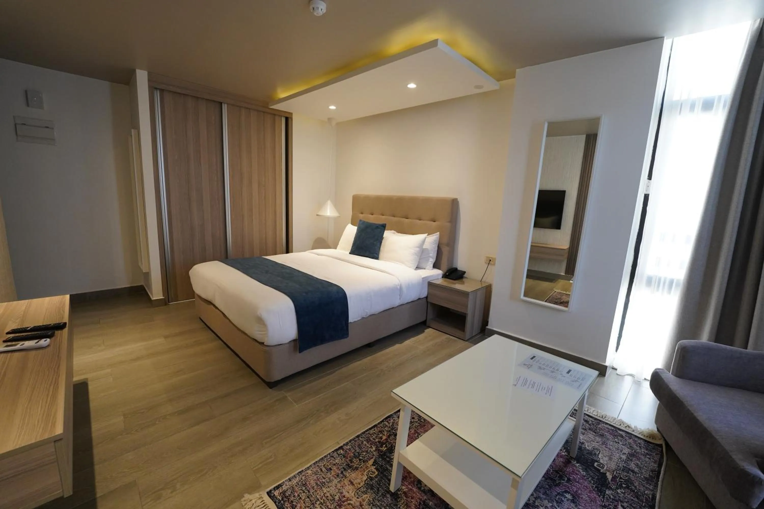 Bed in Red Carpet Hotel & Suites