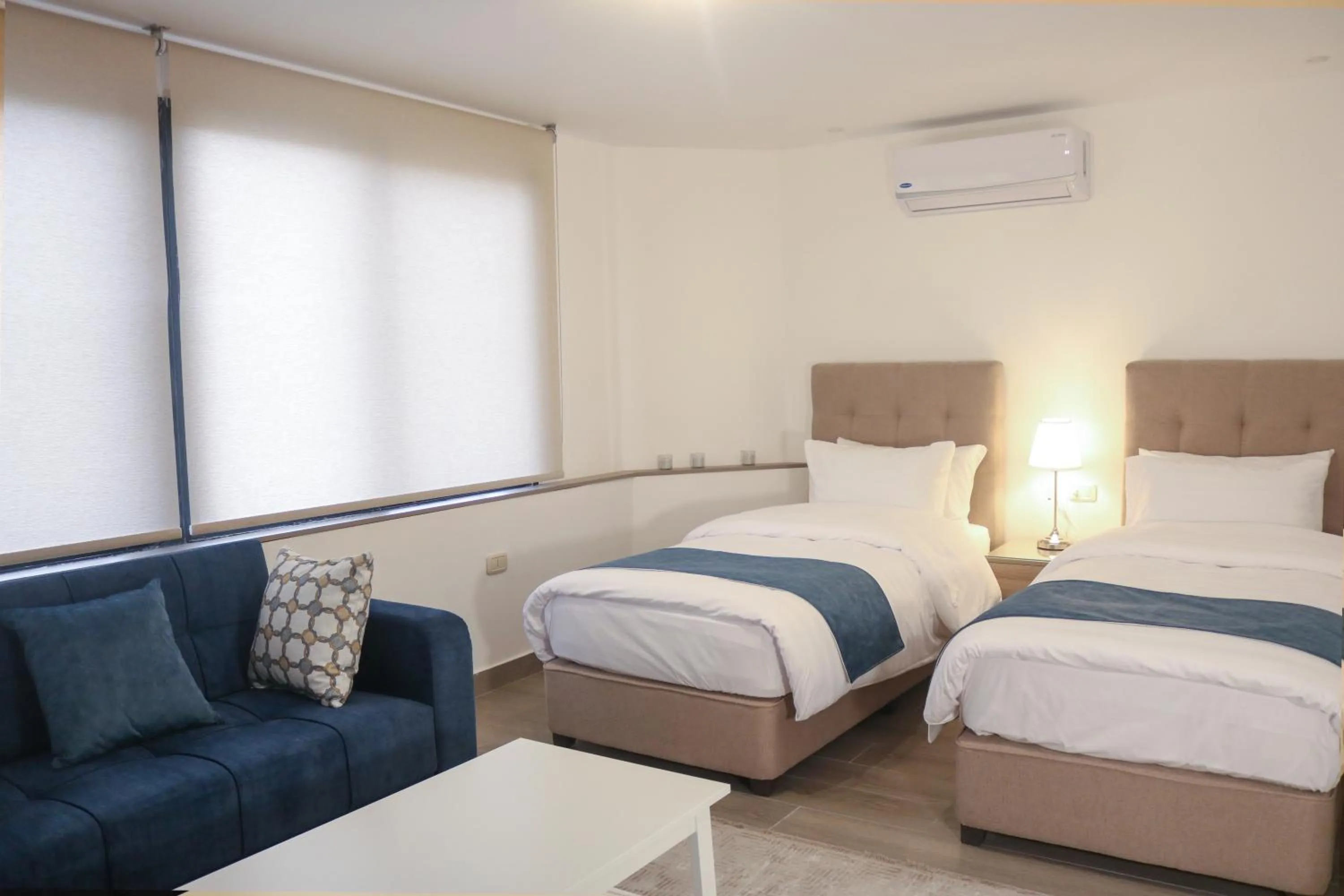 Bed in Red Carpet Hotel & Suites