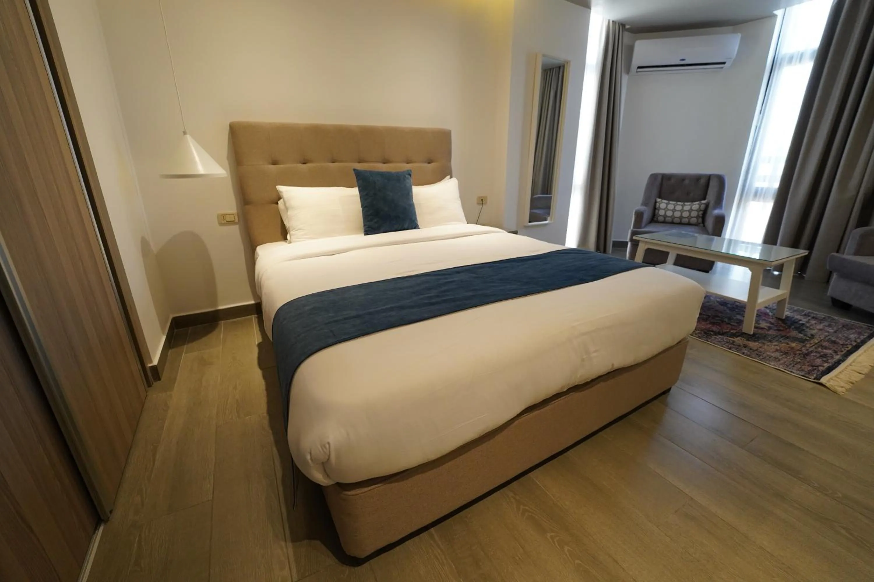 Bed in Red Carpet Hotel & Suites