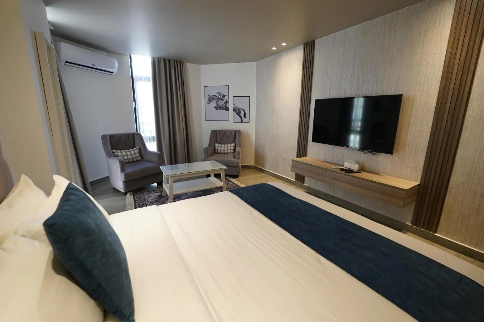 Bed in Red Carpet Hotel & Suites