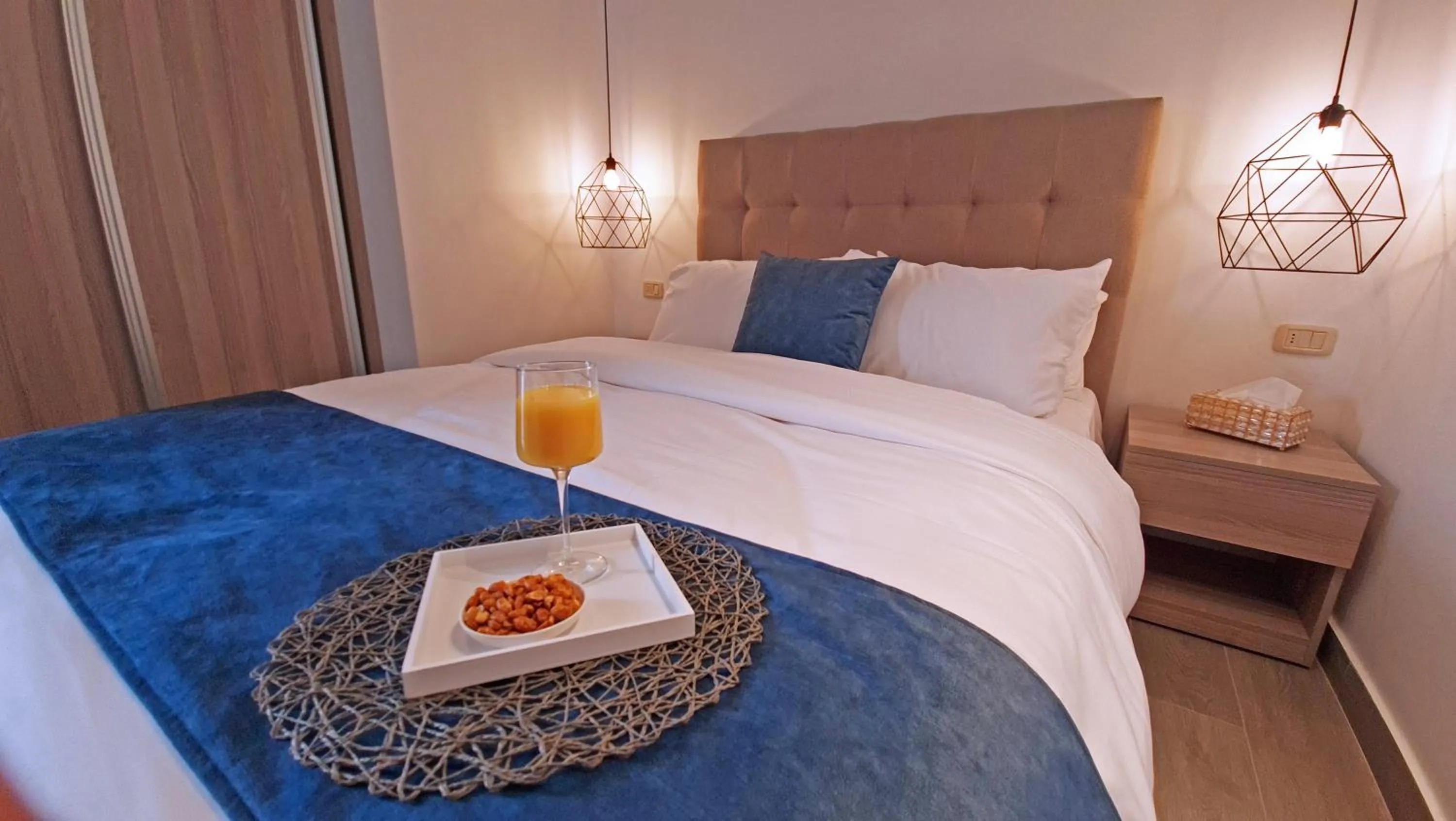 Bed in Red Carpet Hotel & Suites