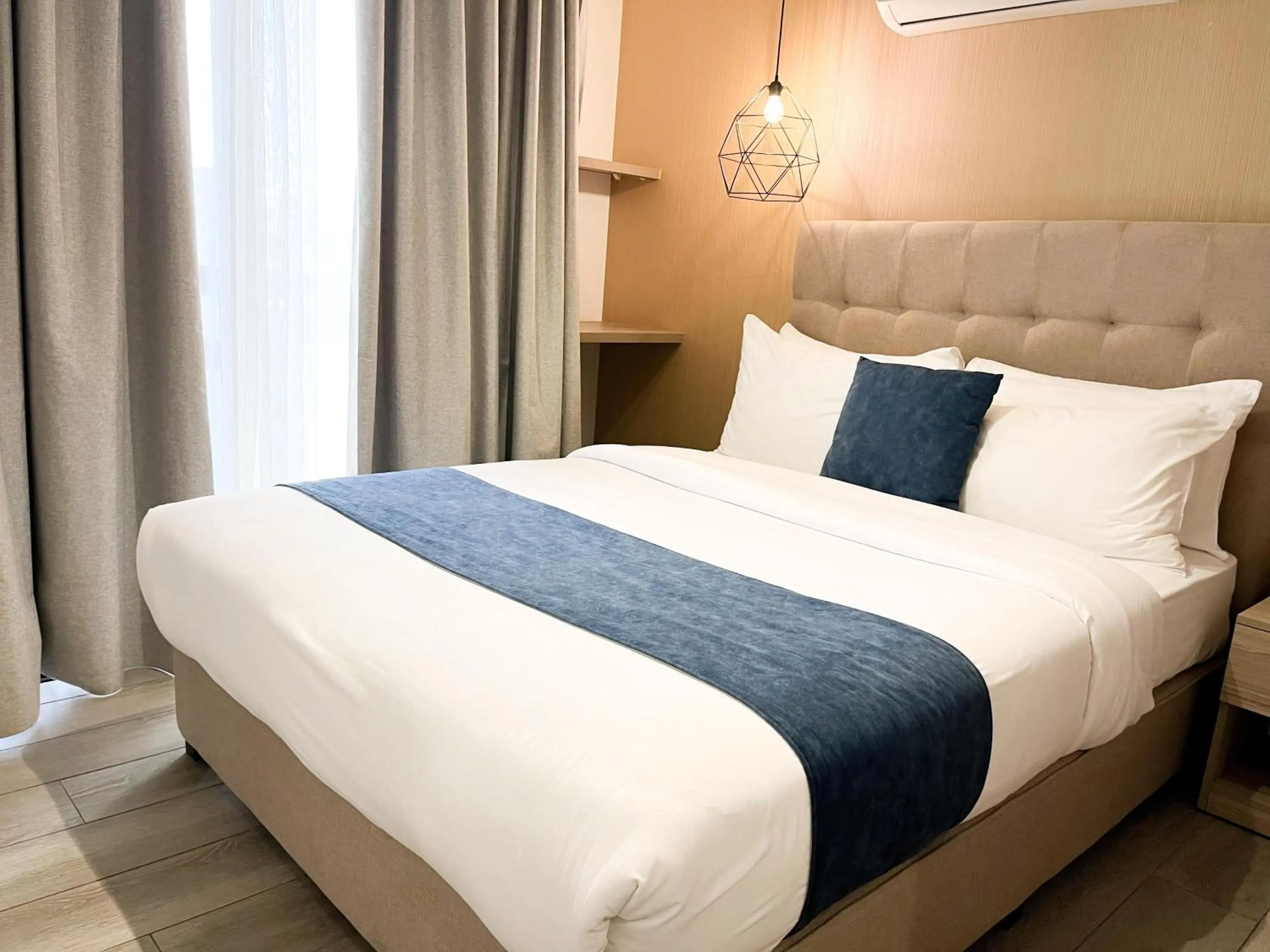 Photo of the whole room, Bed in Red Carpet Hotel & Suites