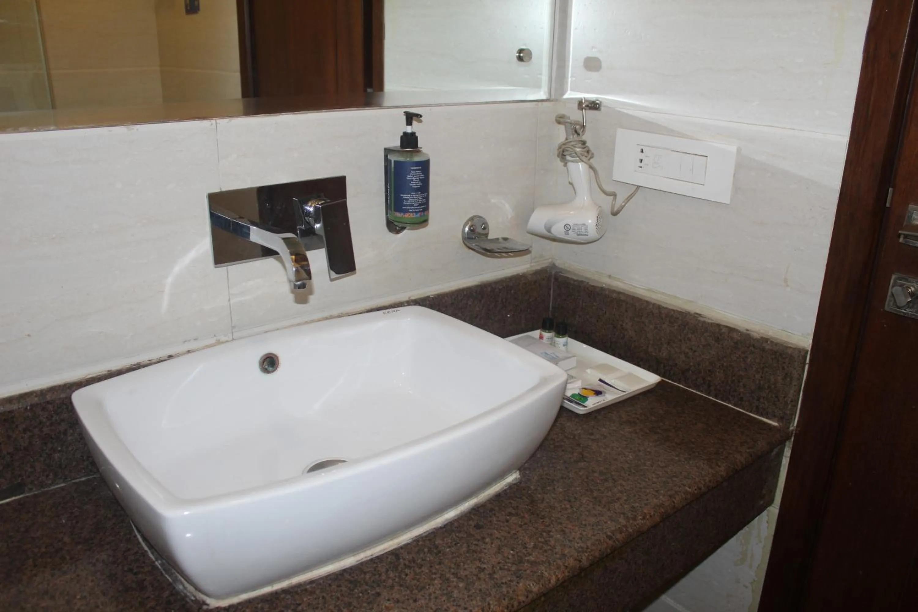 Bathroom in THE J K Hotel C R Park