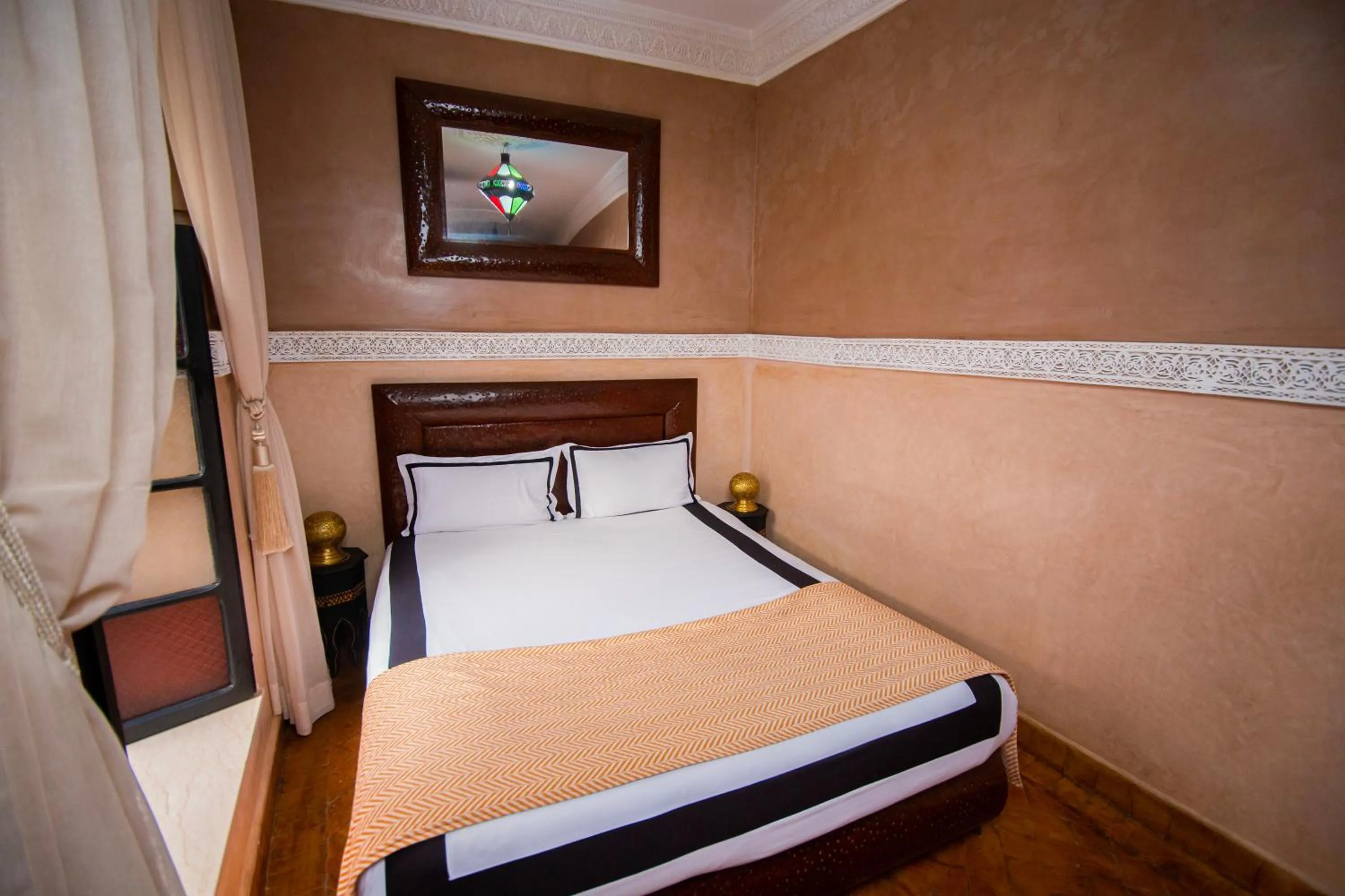 Bed in Riad Ta'achchaqa