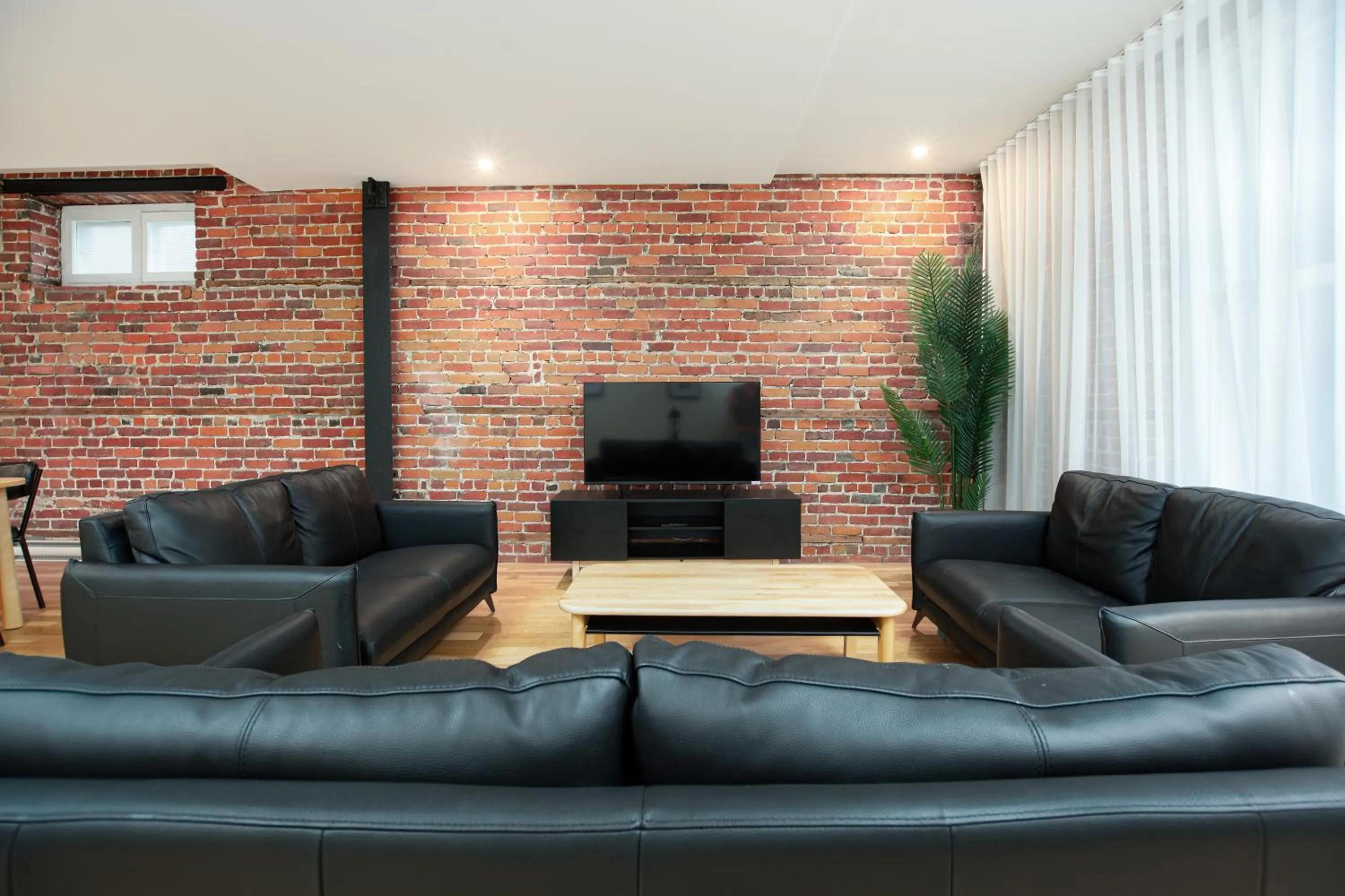 Communal lounge/ TV room in Les Lofts de la Barricade - Par les Lofts Vieux-Québec