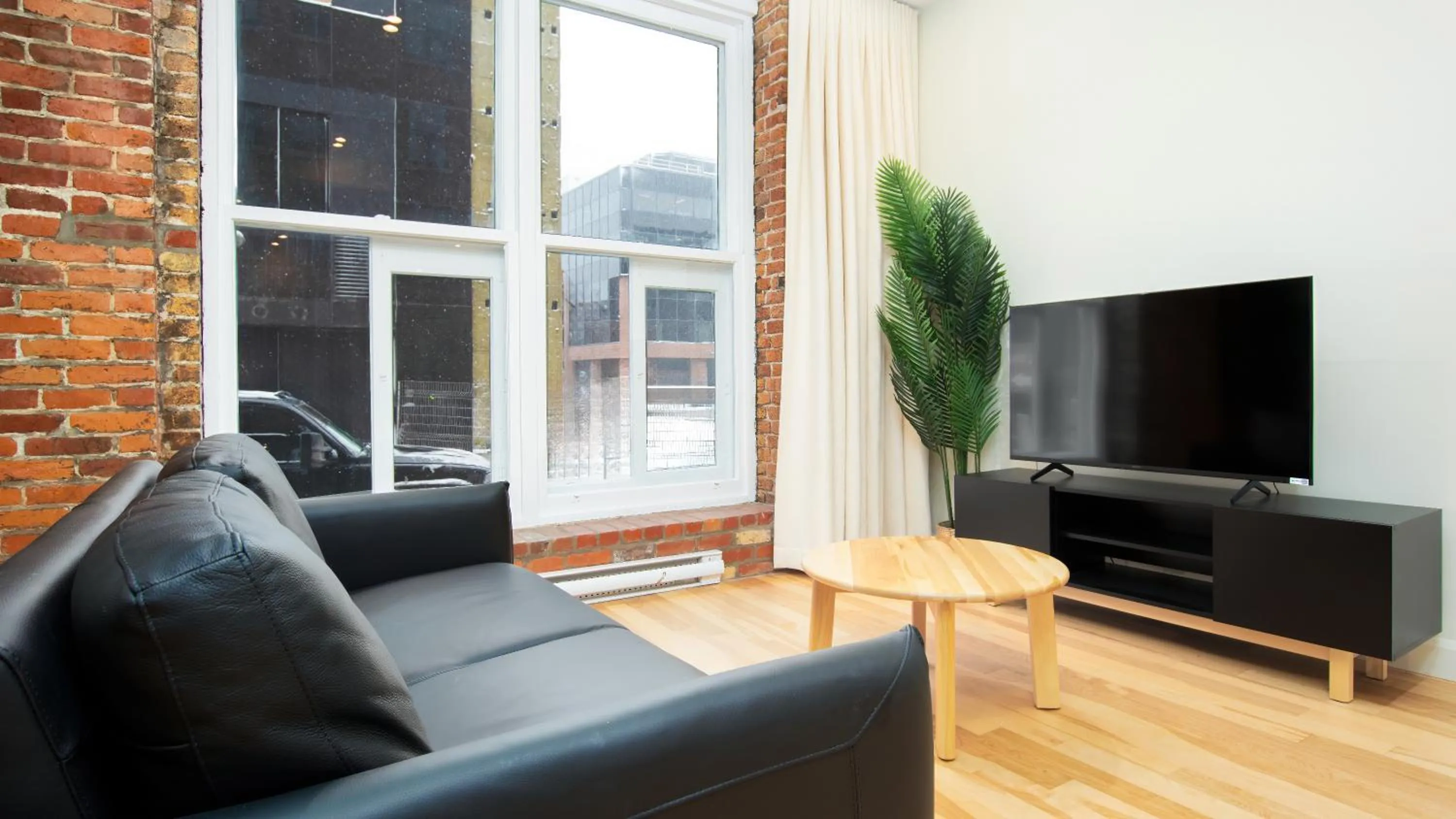Communal lounge/ TV room in Les Lofts de la Barricade - Par les Lofts Vieux-Québec