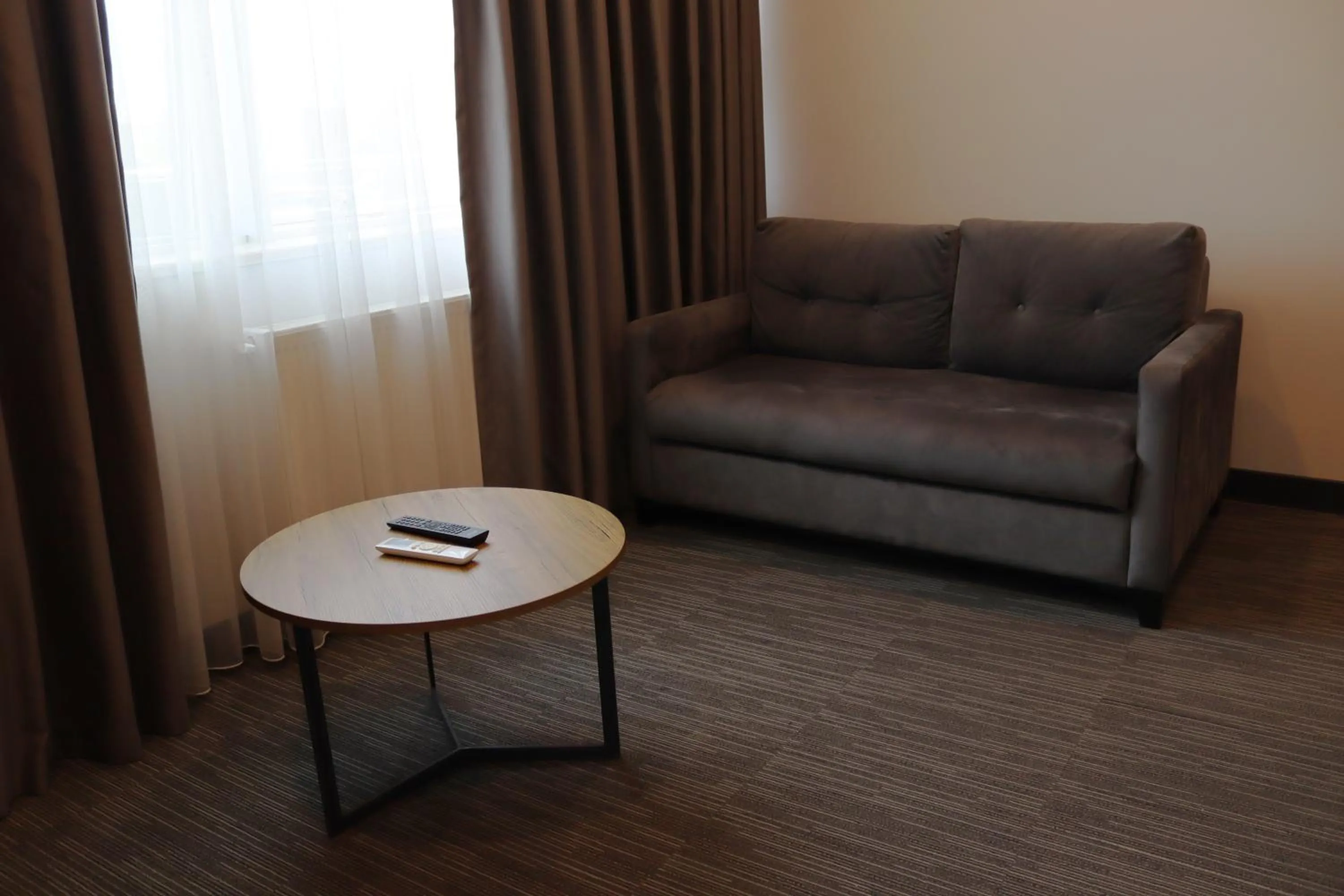 Living room in HOME PLUS Hotel