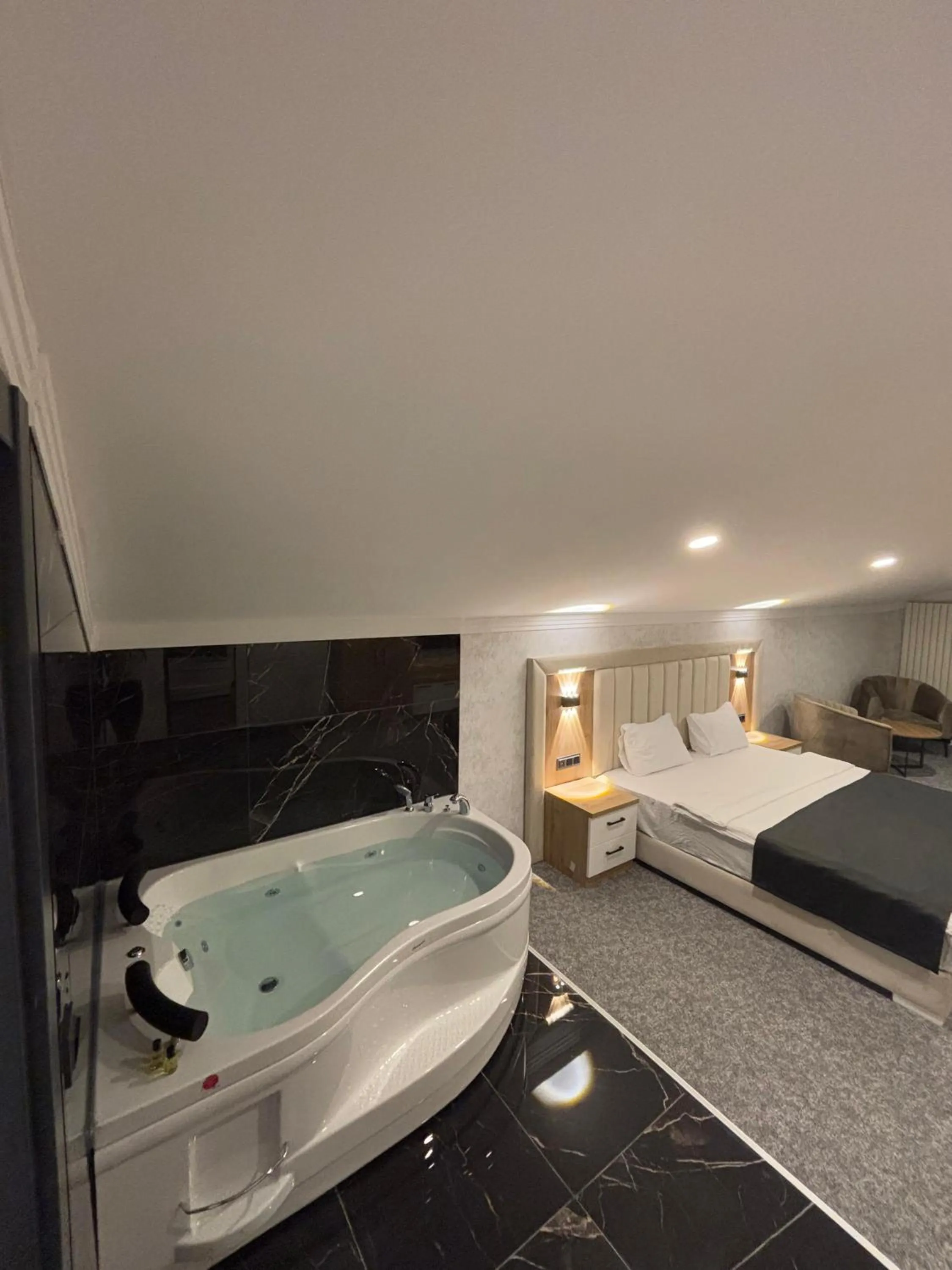 Bed in HOME PLUS Hotel