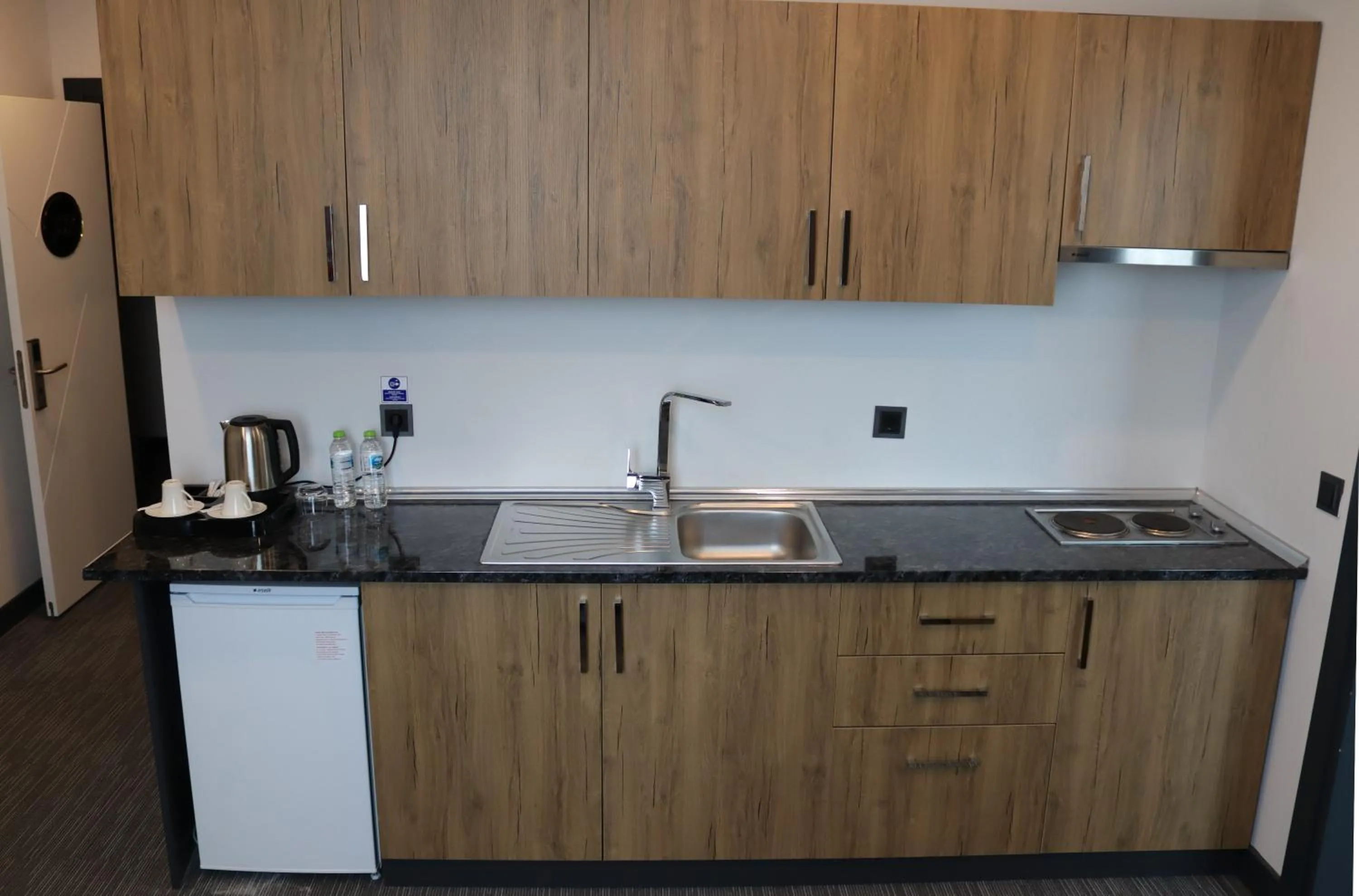 Kitchen or kitchenette in HOME PLUS Hotel