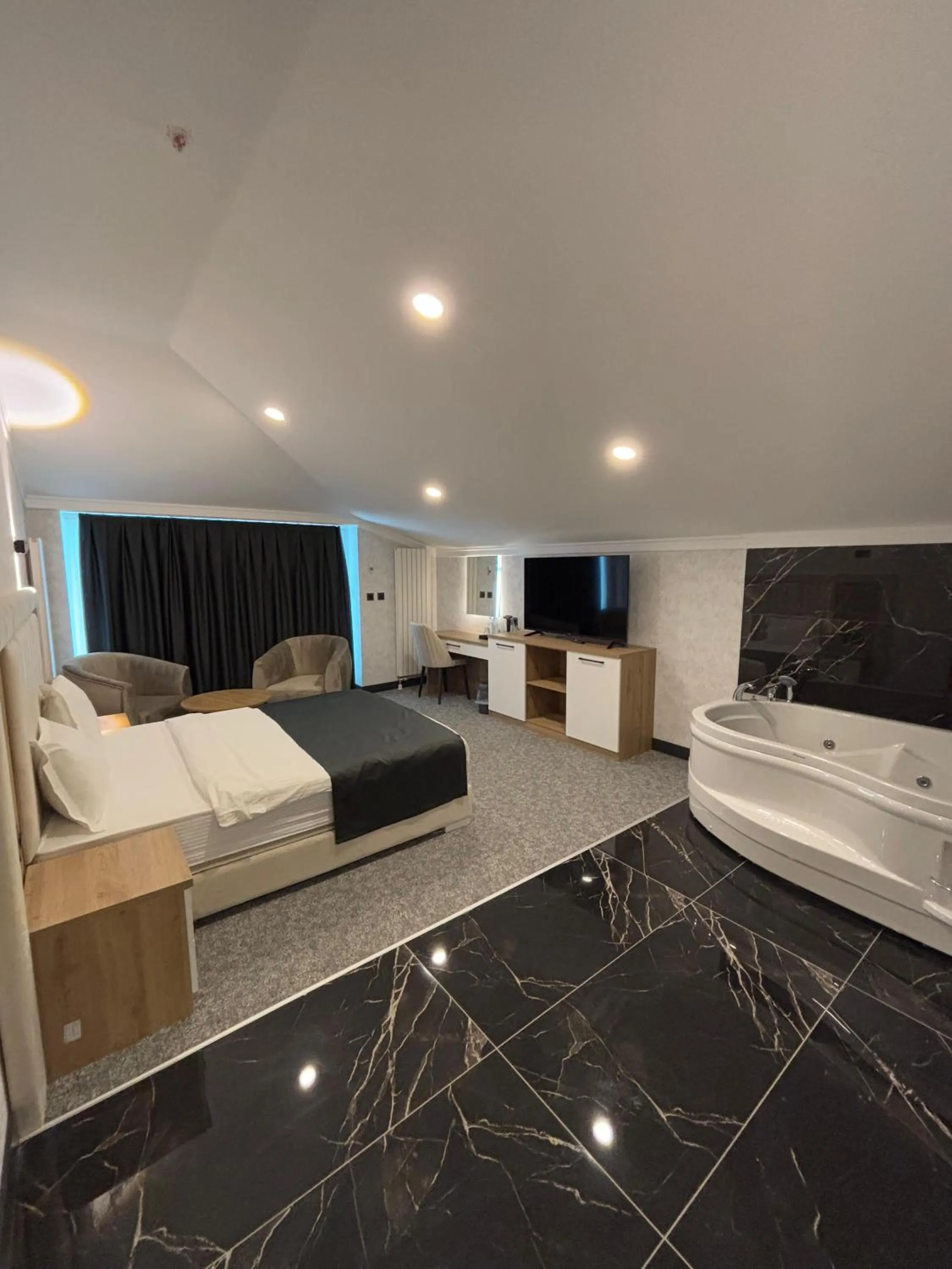 Bed in HOME PLUS Hotel