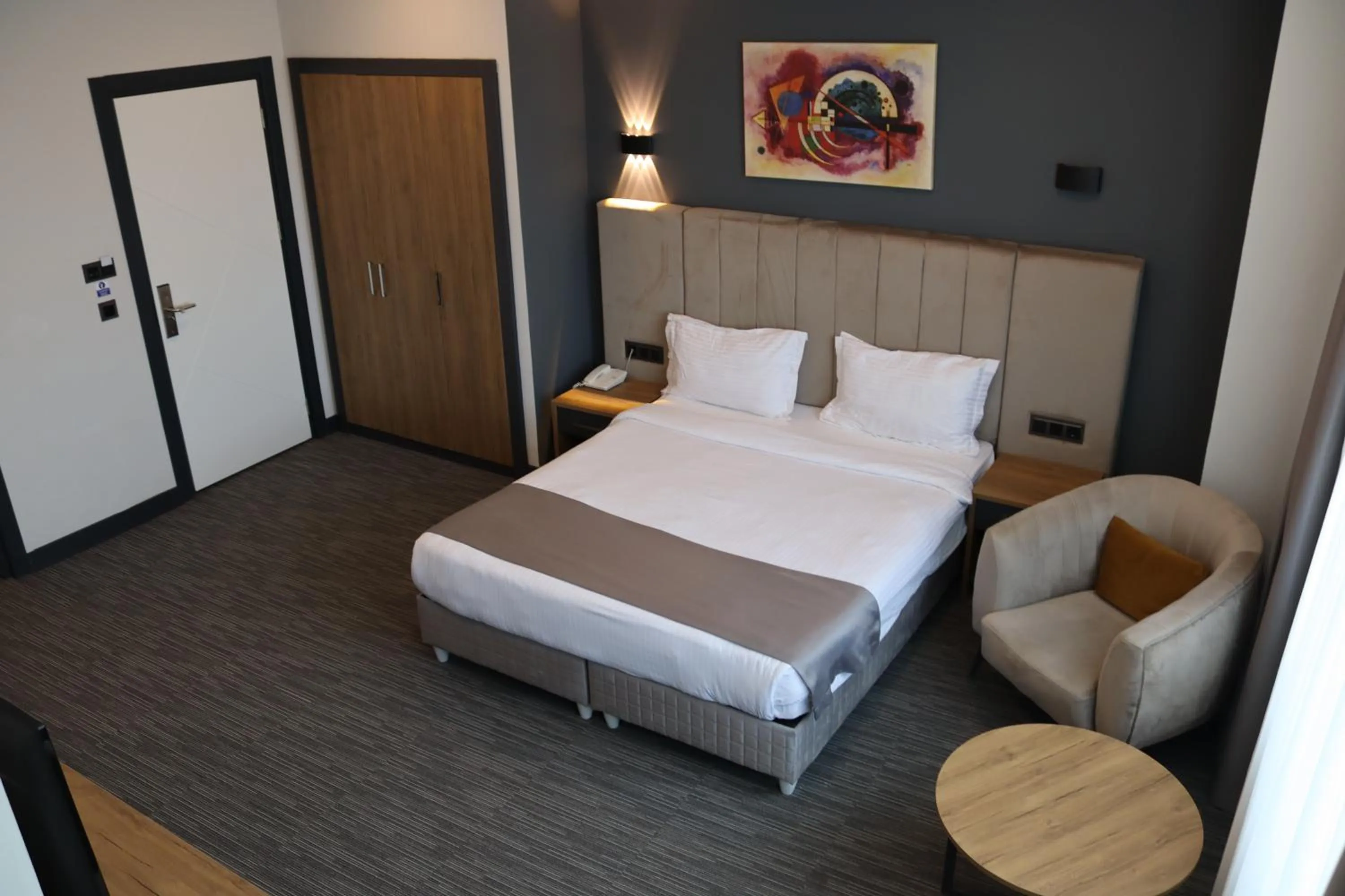 Bed in HOME PLUS Hotel