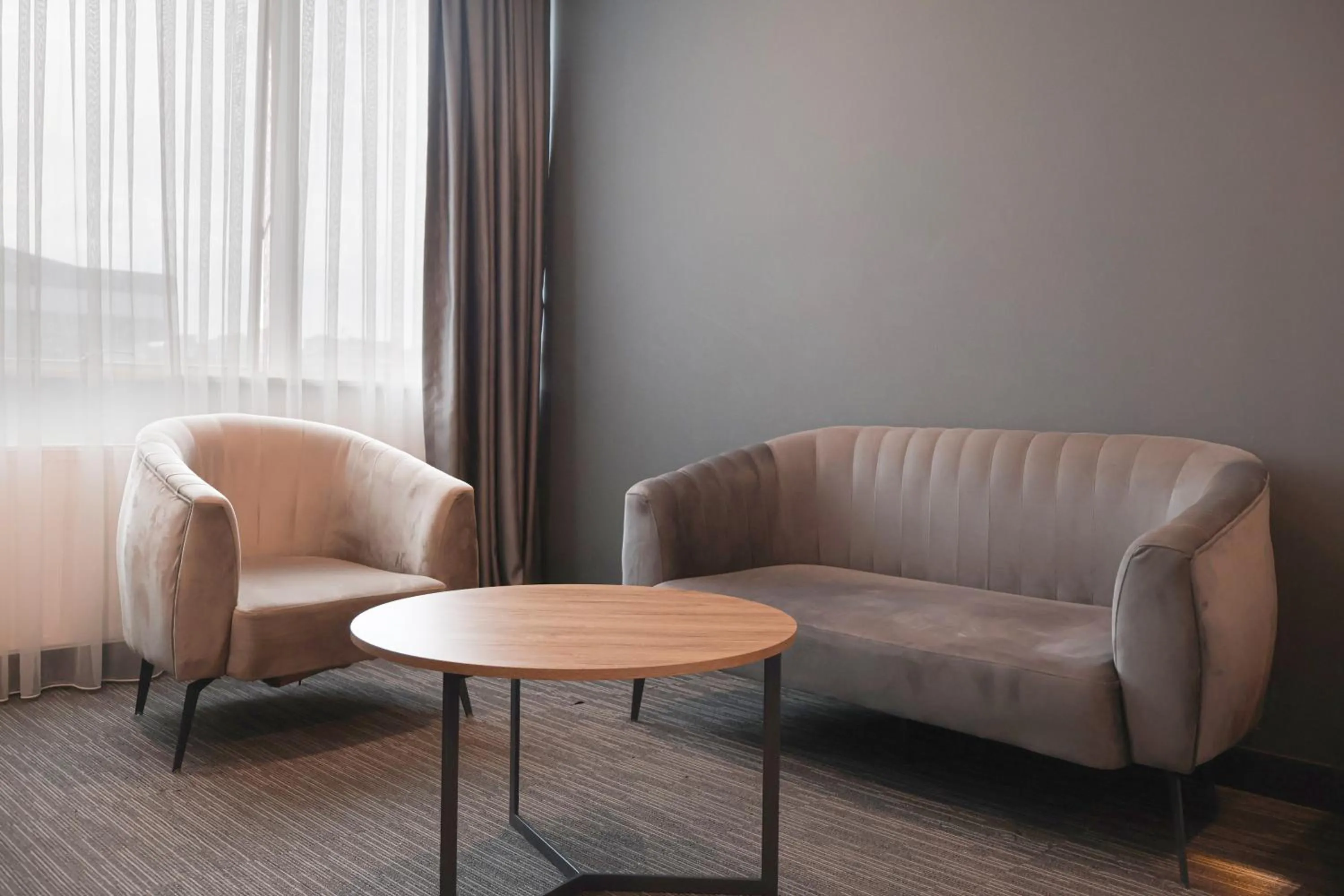 Seating area in HOME PLUS Hotel