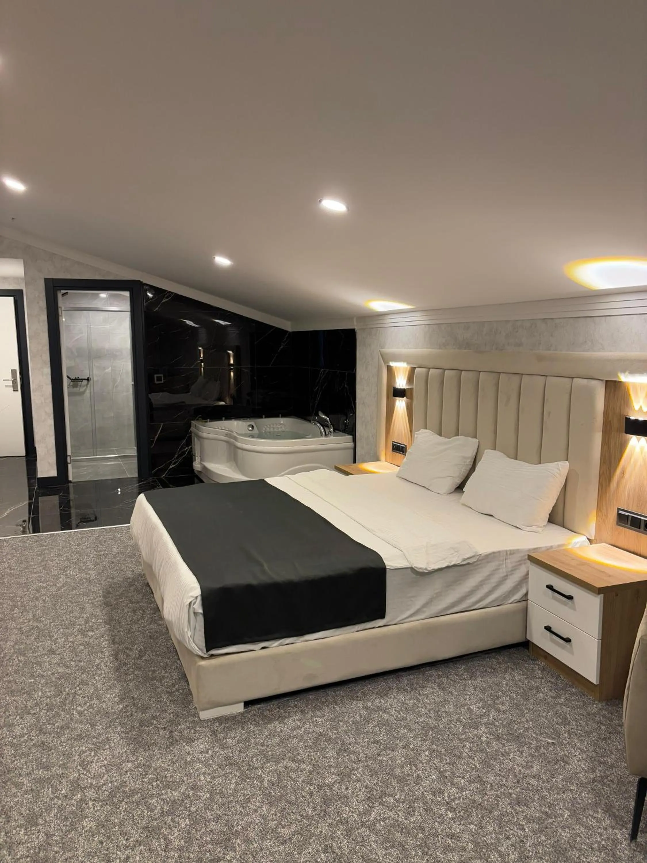 Living room, Bed in HOME PLUS Hotel