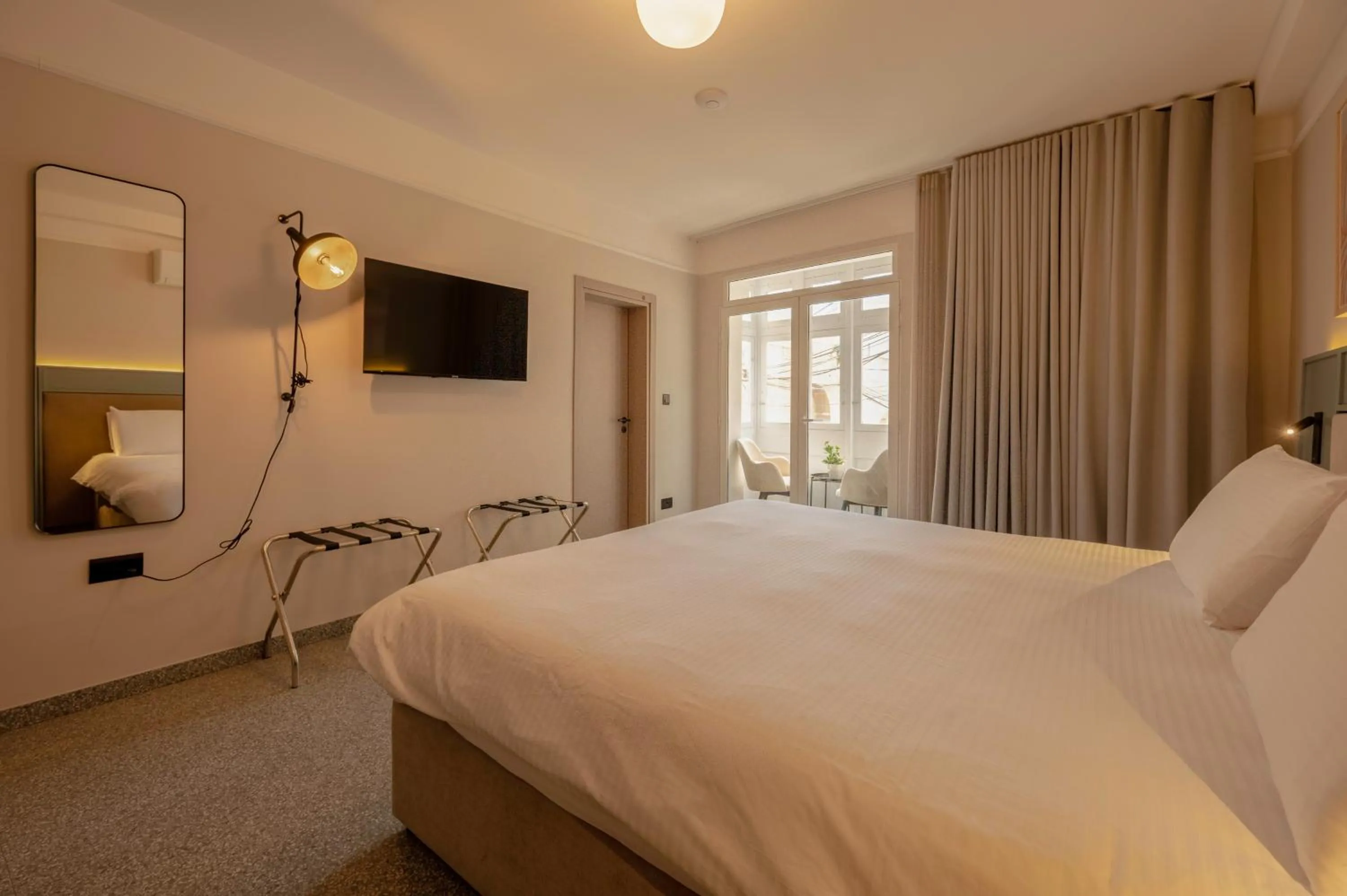 Bed in Maria Rosa Suites