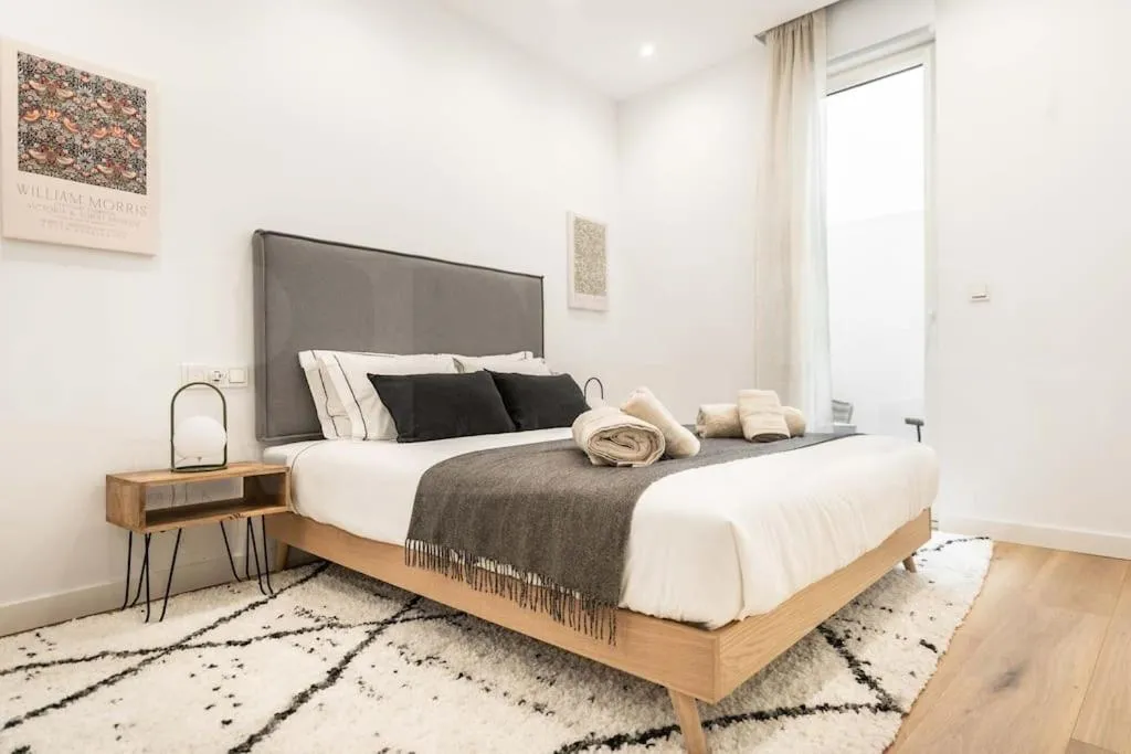 Bed in Calm apartment with private patio by REMS