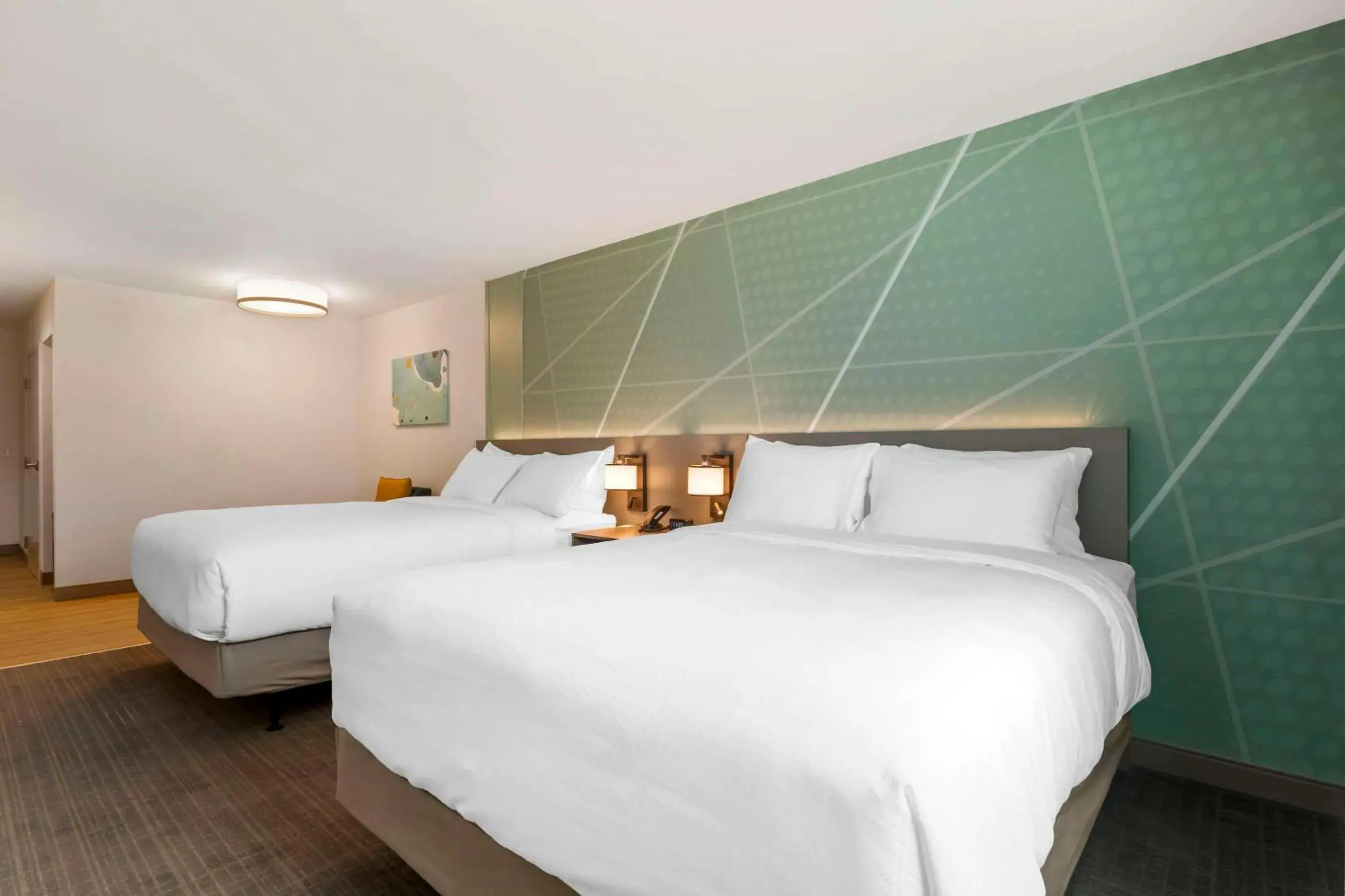 Bedroom, Bed in Comfort Suites St Augustine Historic District Area Bedroom, Bed in Comfort Suites St Augustine Historic District Area