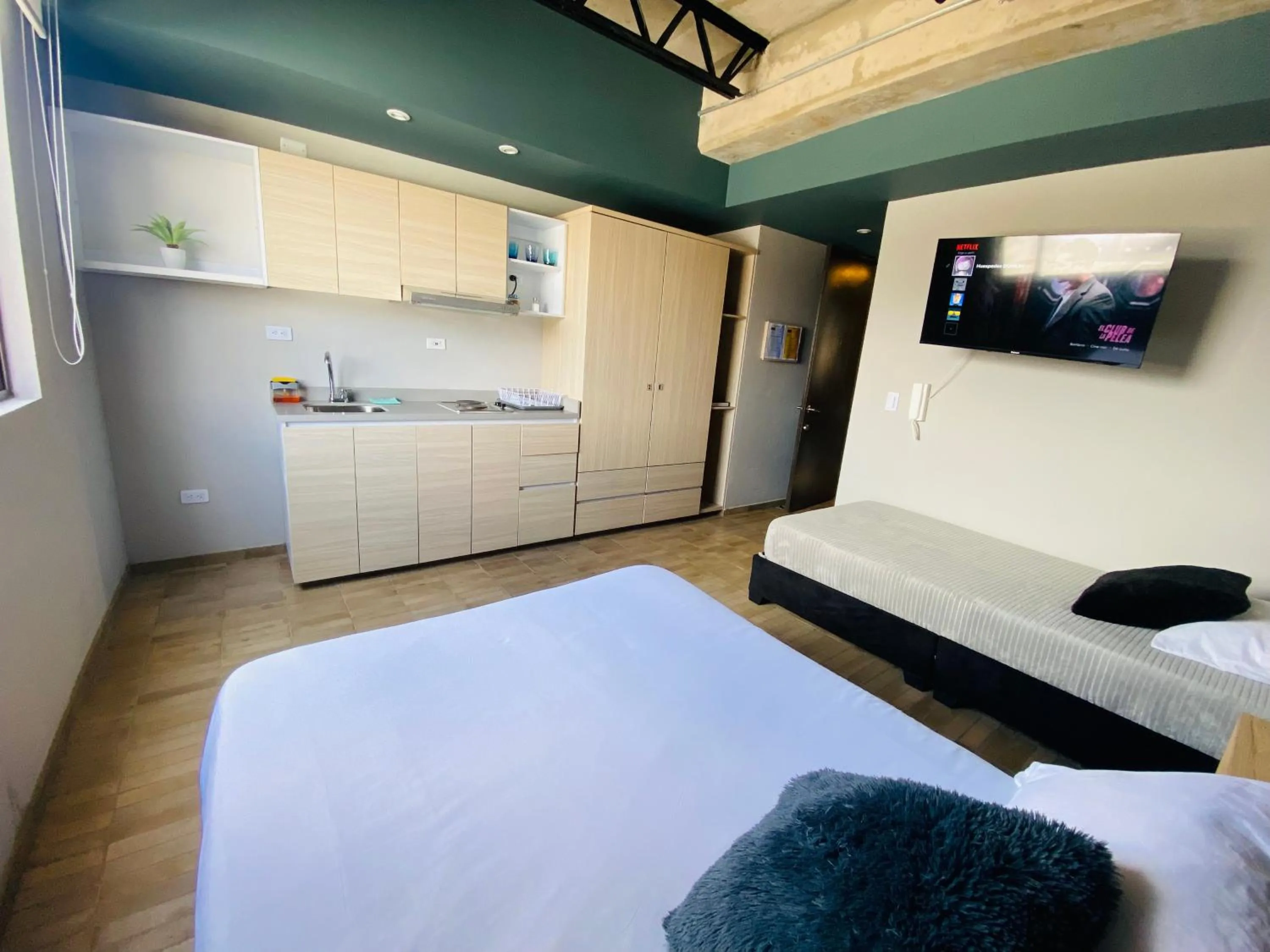 Kitchen or kitchenette, Bed in Cadena Hotelera Rey es