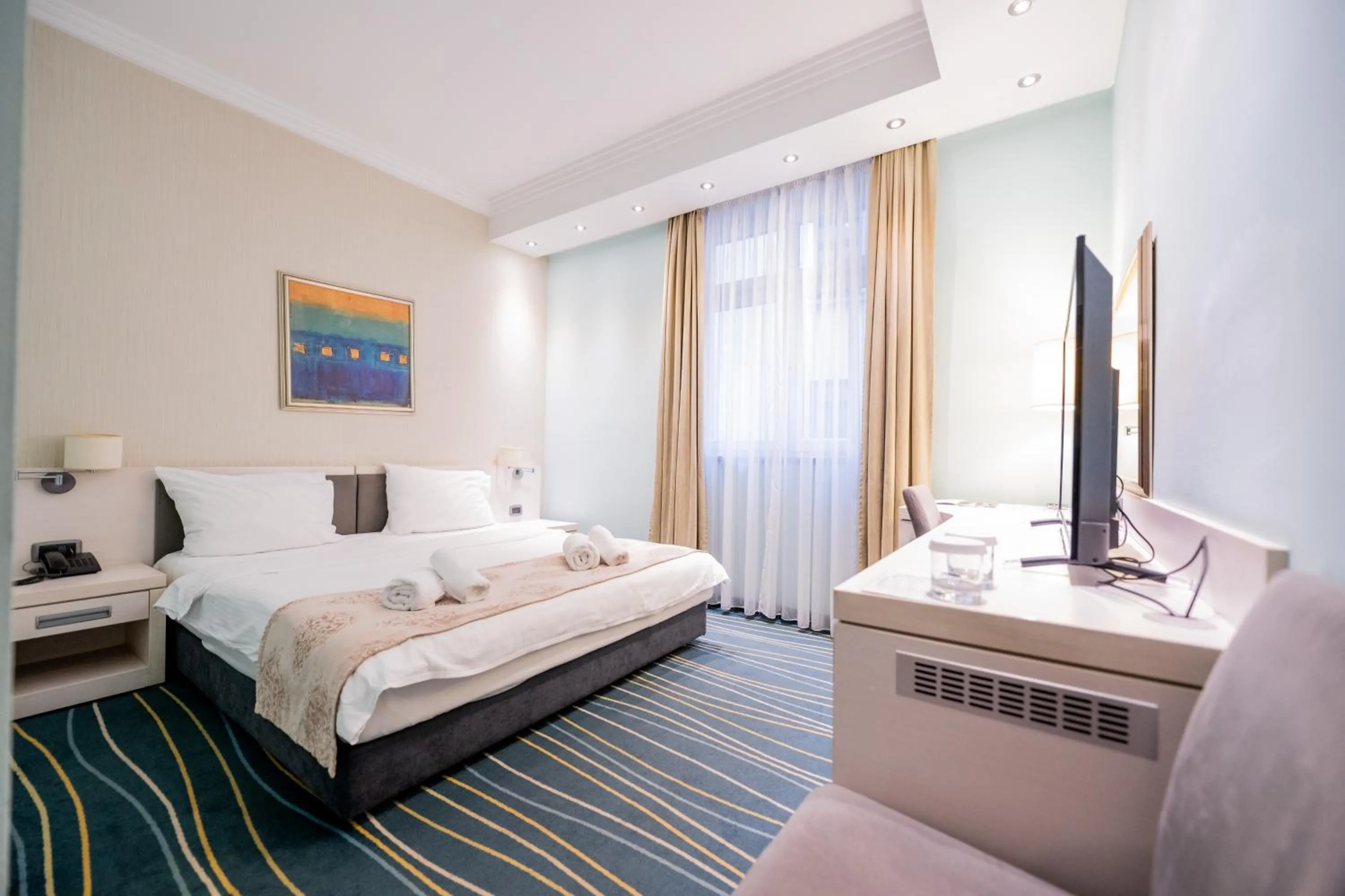 Communal lounge/ TV room, Bed in Kopernikus Hotel Prag