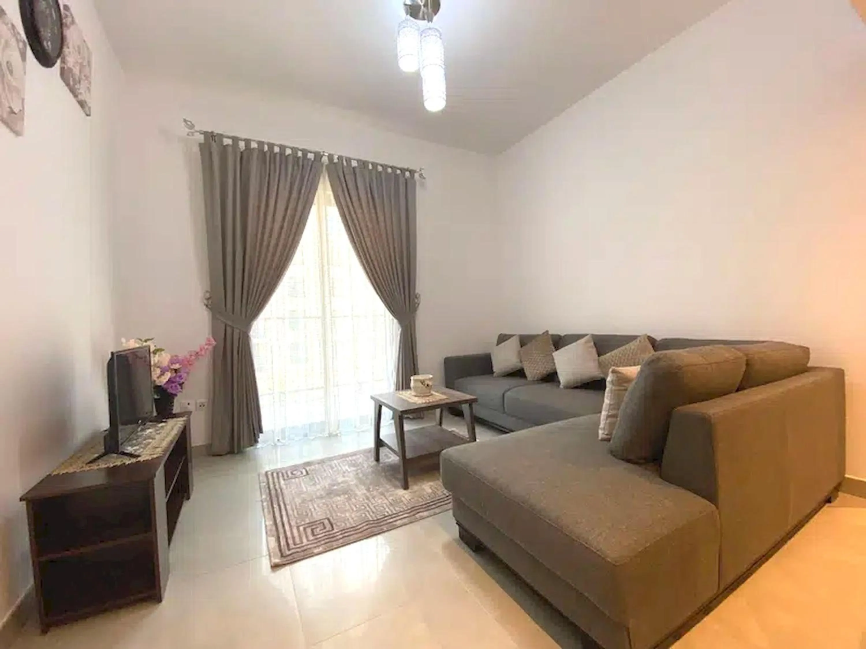 TV and multimedia, Seating Area in Super OYO 928 Home 436 Binghatti Mirage - 1Br, Jvc