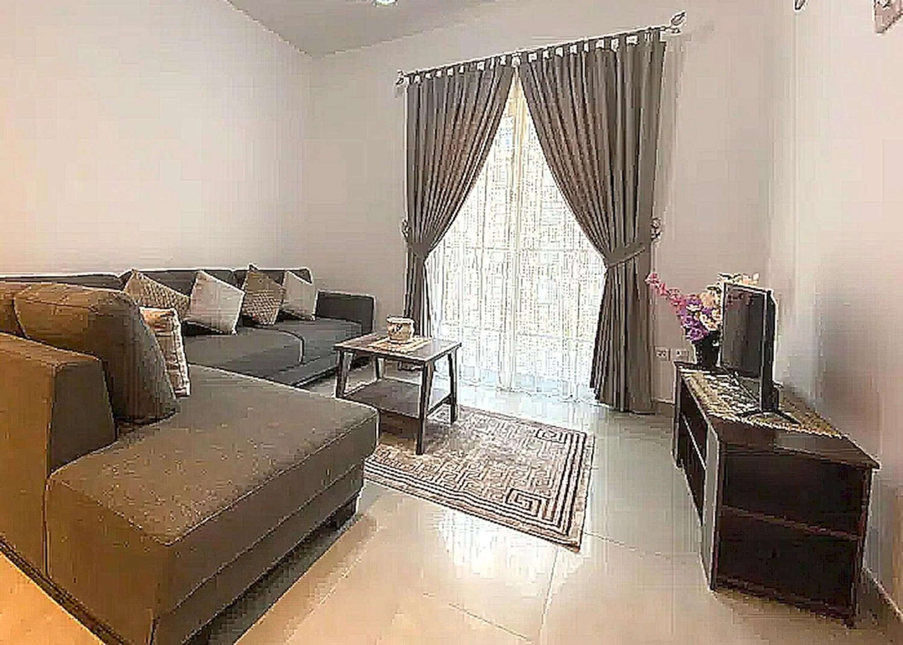 TV and multimedia, Seating Area in Super OYO 928 Home 436 Binghatti Mirage - 1Br, Jvc