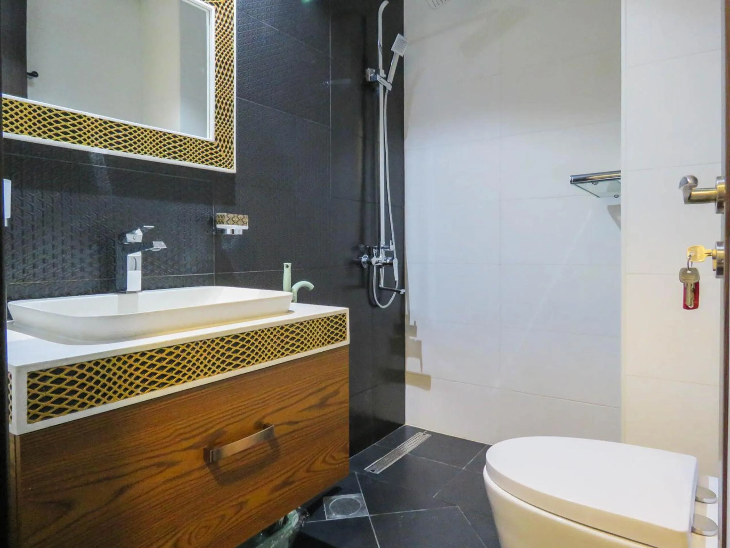 Bathroom in OYO 943 Home Bayz Danube studio