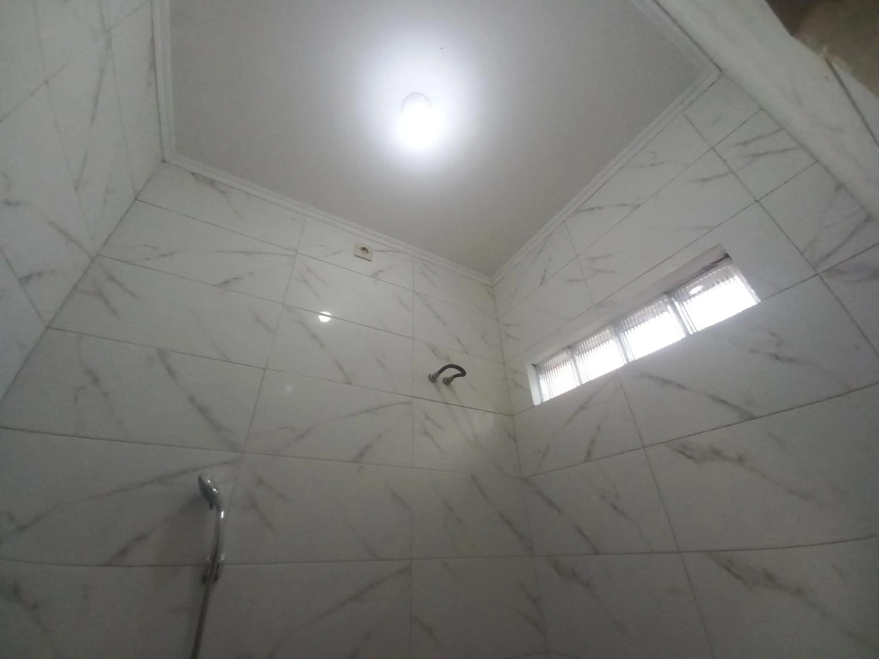 Bathroom in SPOT ON 92415 Bima House Syariah