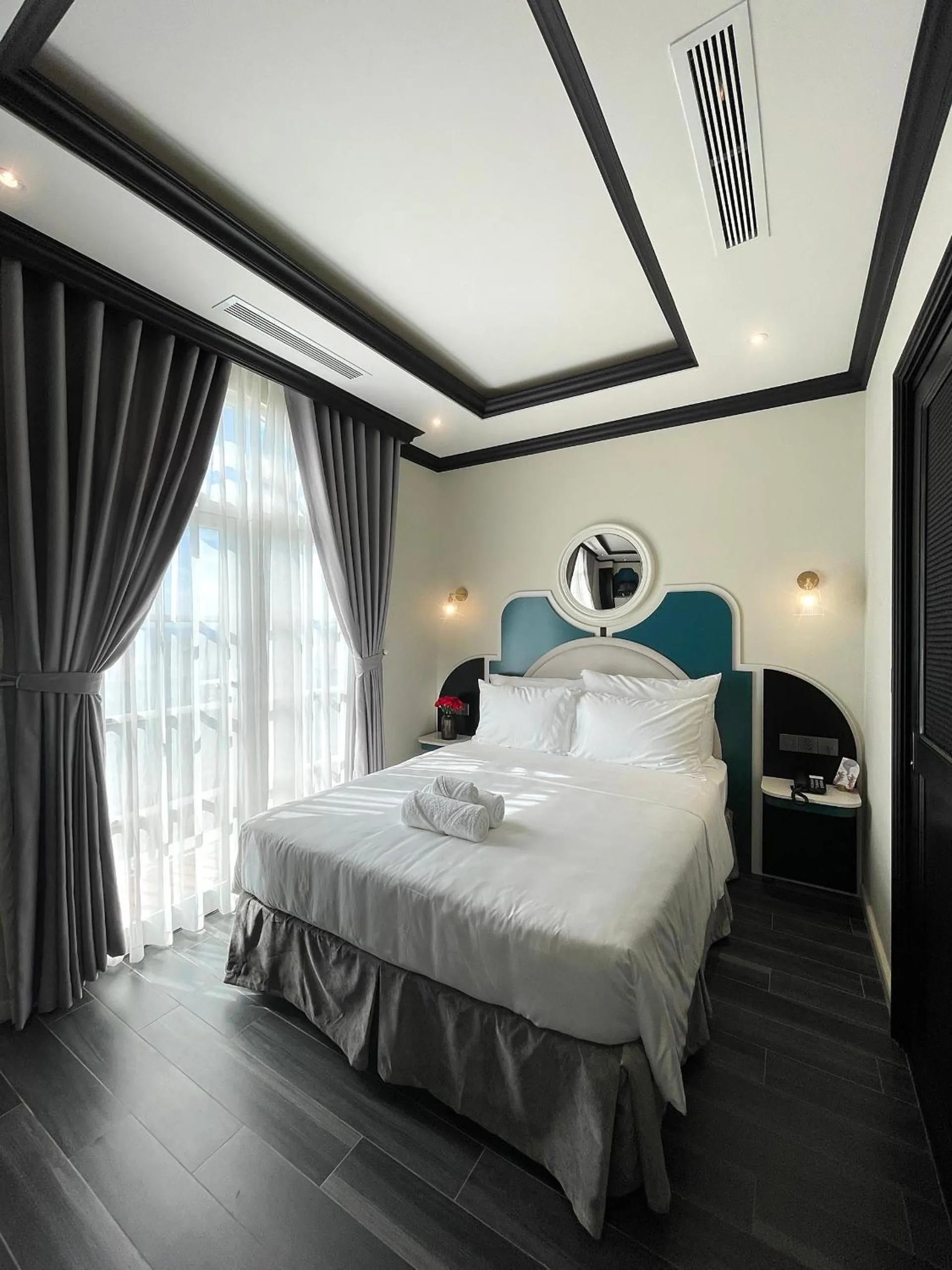 Bed in Le Bonheur Hotel