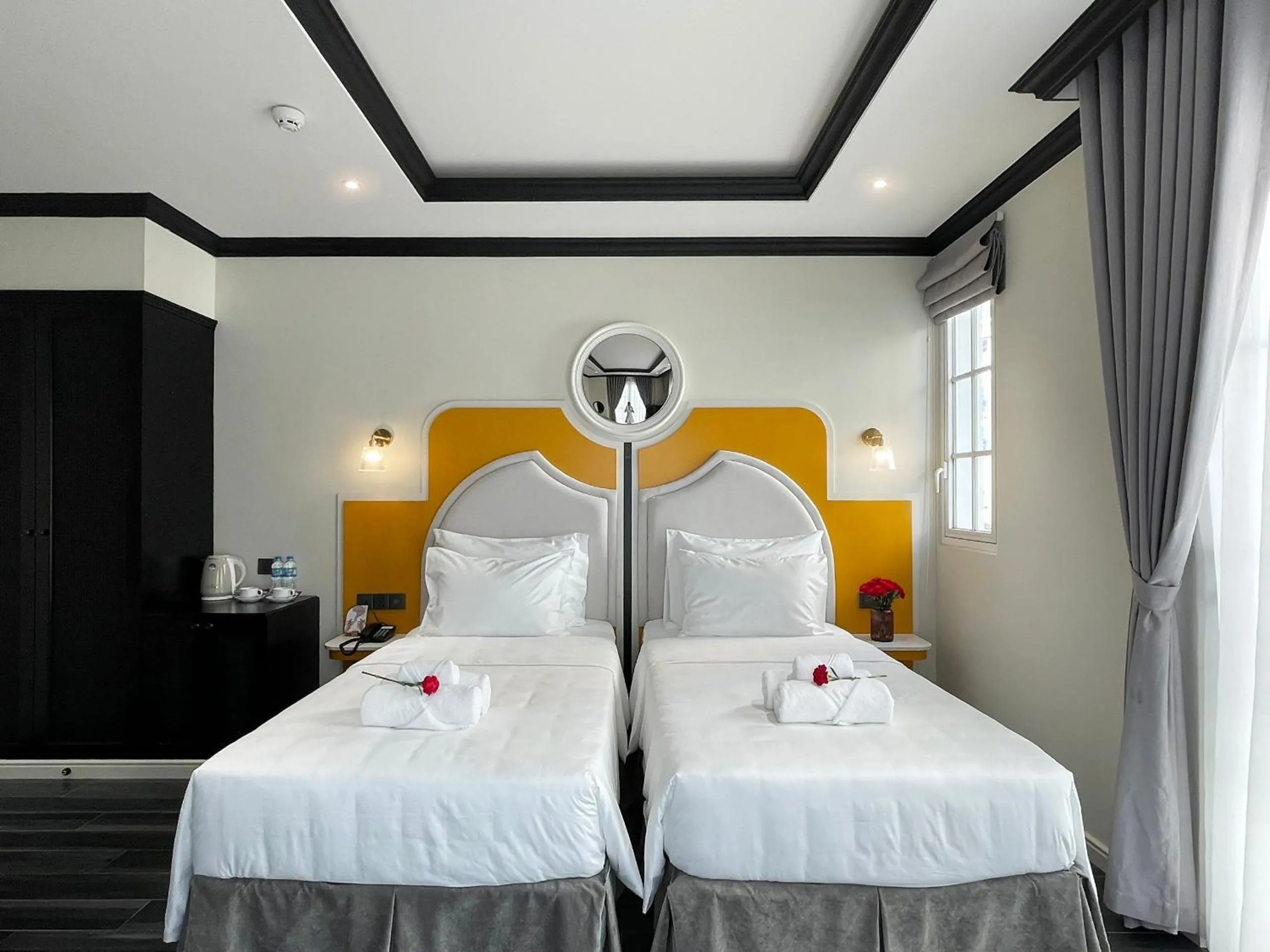 Bed in Le Bonheur Hotel