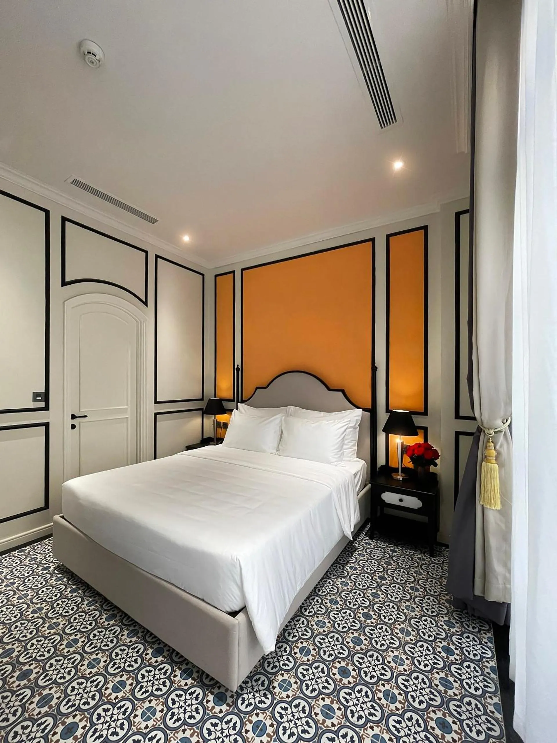 Bed in Le Bonheur Hotel