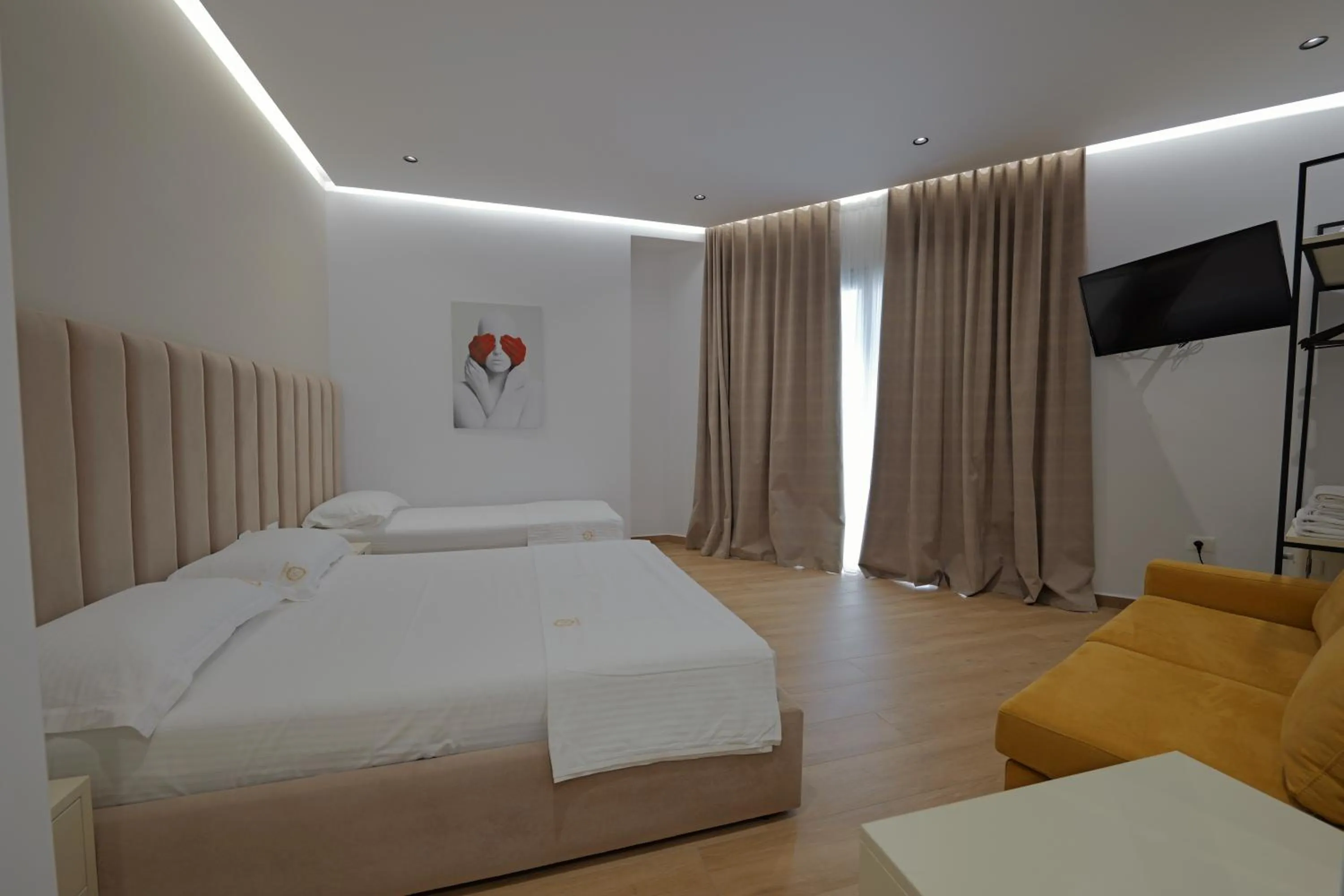 Communal lounge/ TV room, Bed in Sea & Sand Hotel