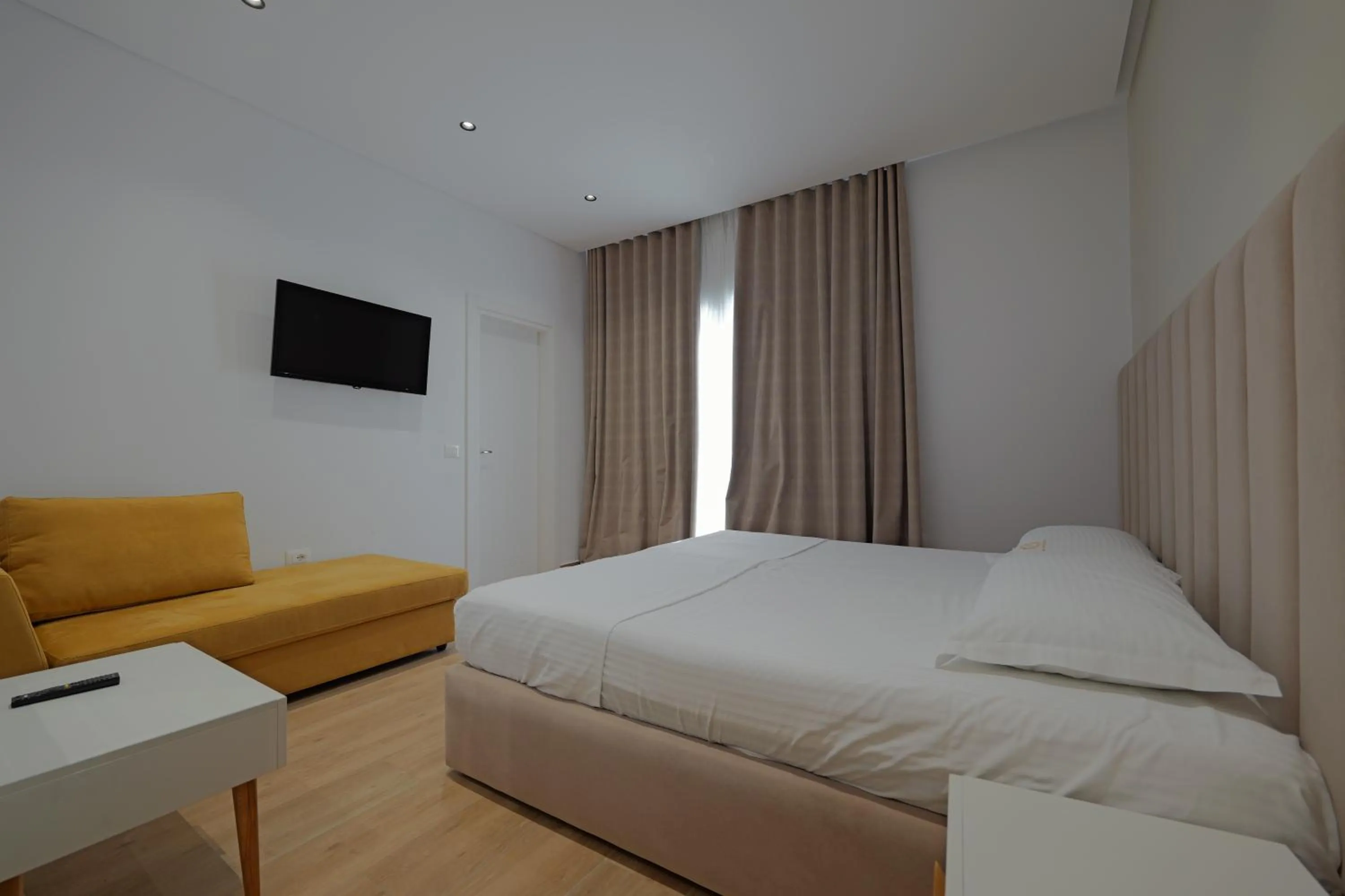 Communal lounge/ TV room, Bed in Sea & Sand Hotel