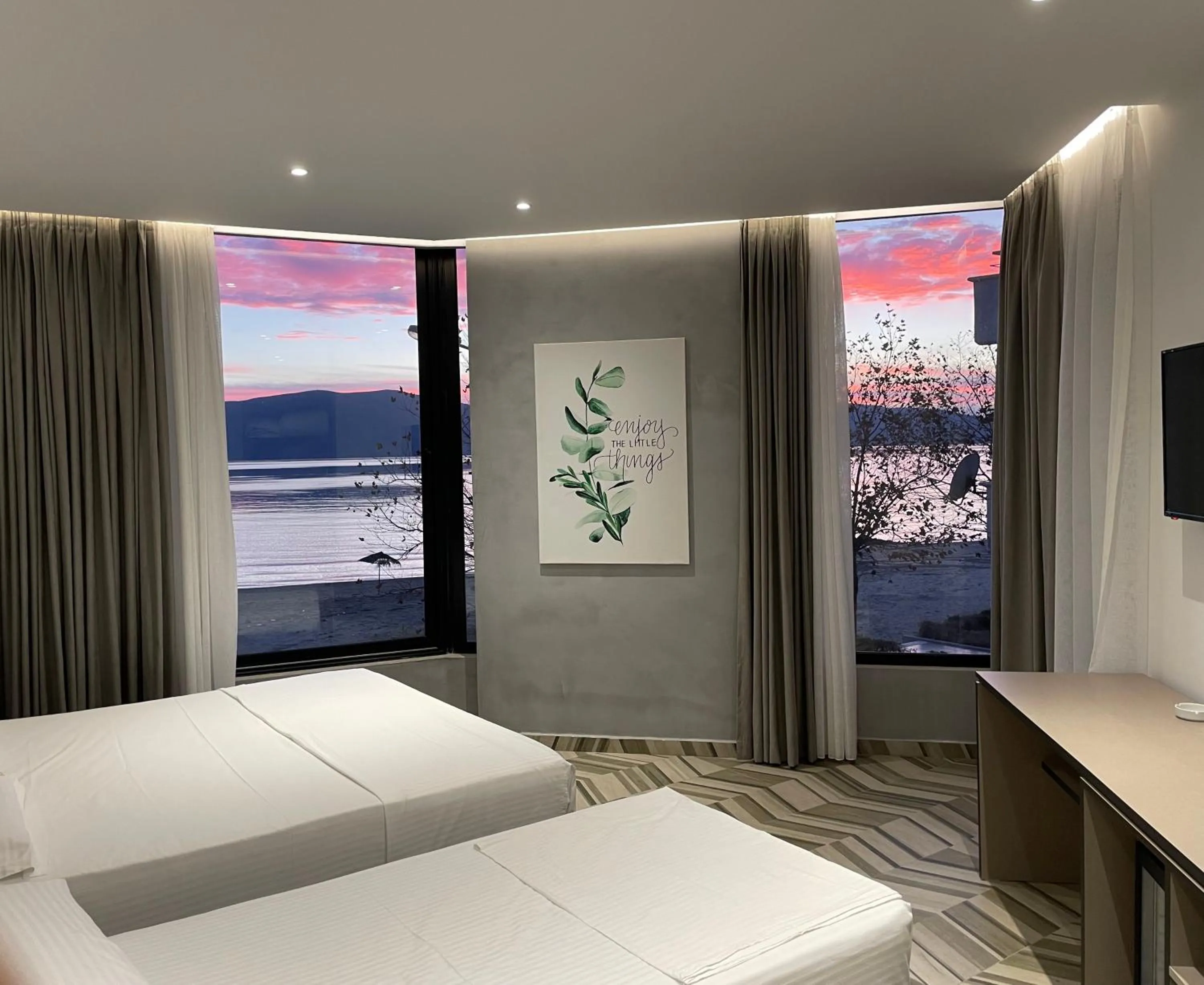 Communal lounge/ TV room, Bed in Sea & Sand Hotel