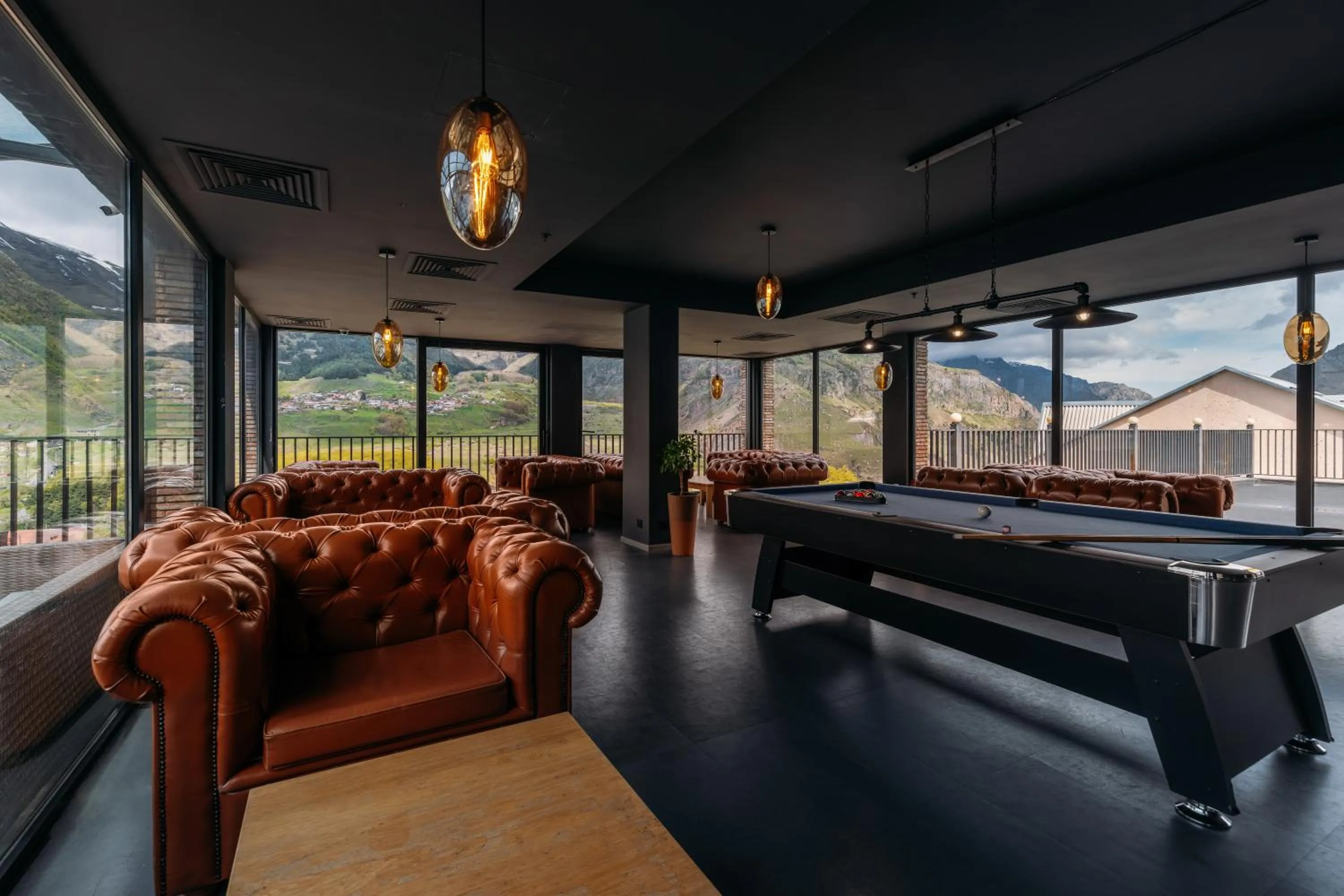 Seating area in Hotel Memoir Kazbegi by DNT Group