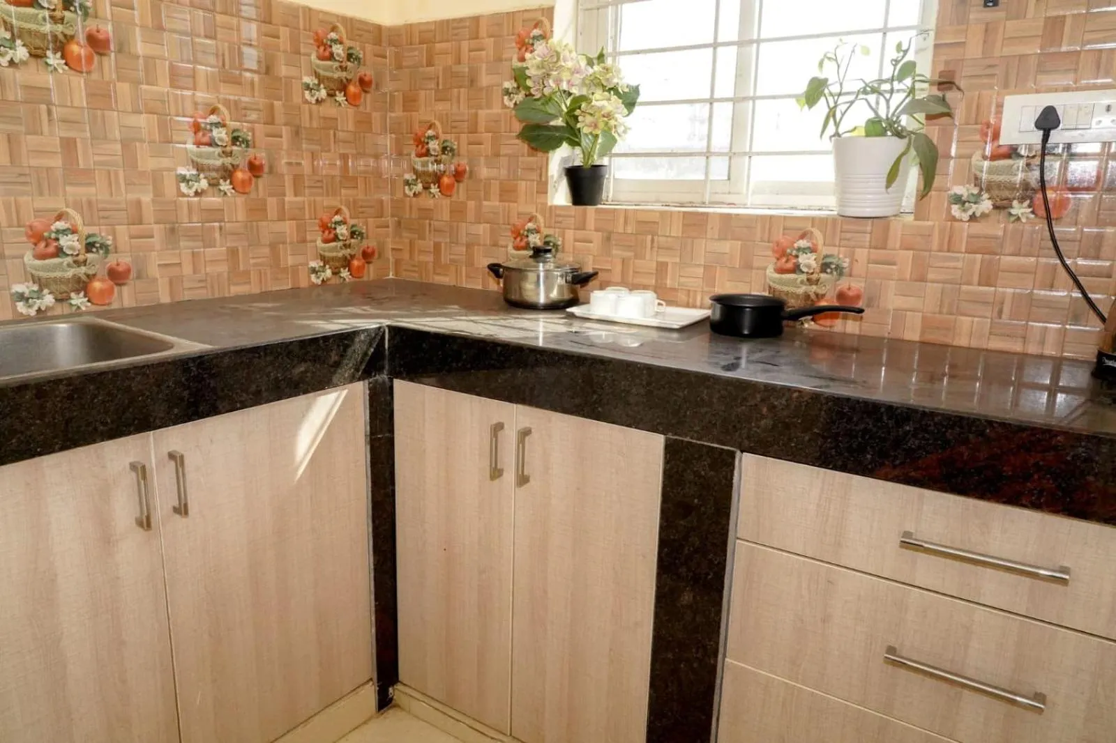 Kitchen or kitchenette in HOTEL ROYAL SUITES AND ROOMS Near AIG Hospital Gachibowli