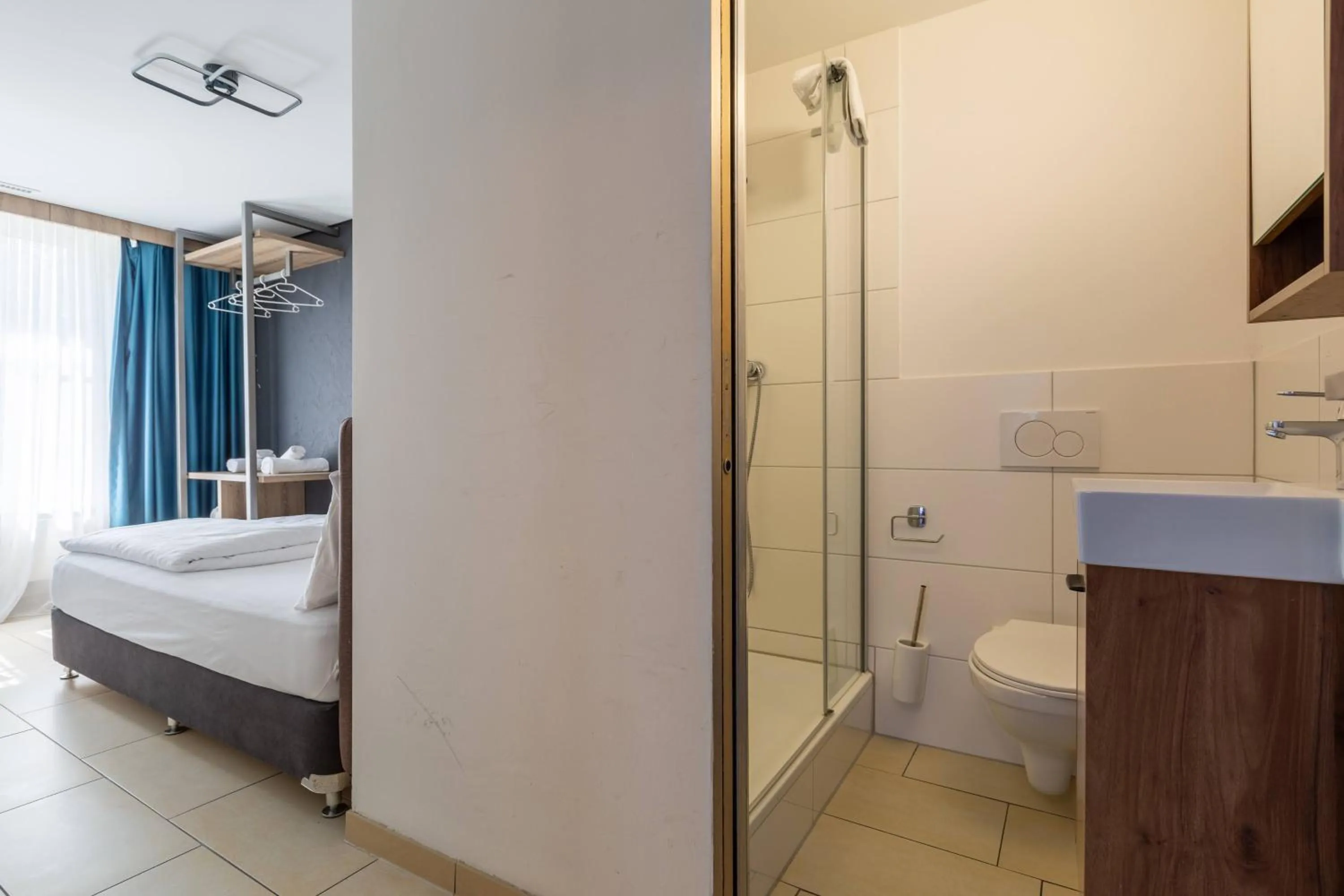 Shower, Bed in Nani City Hotel Self Check-In