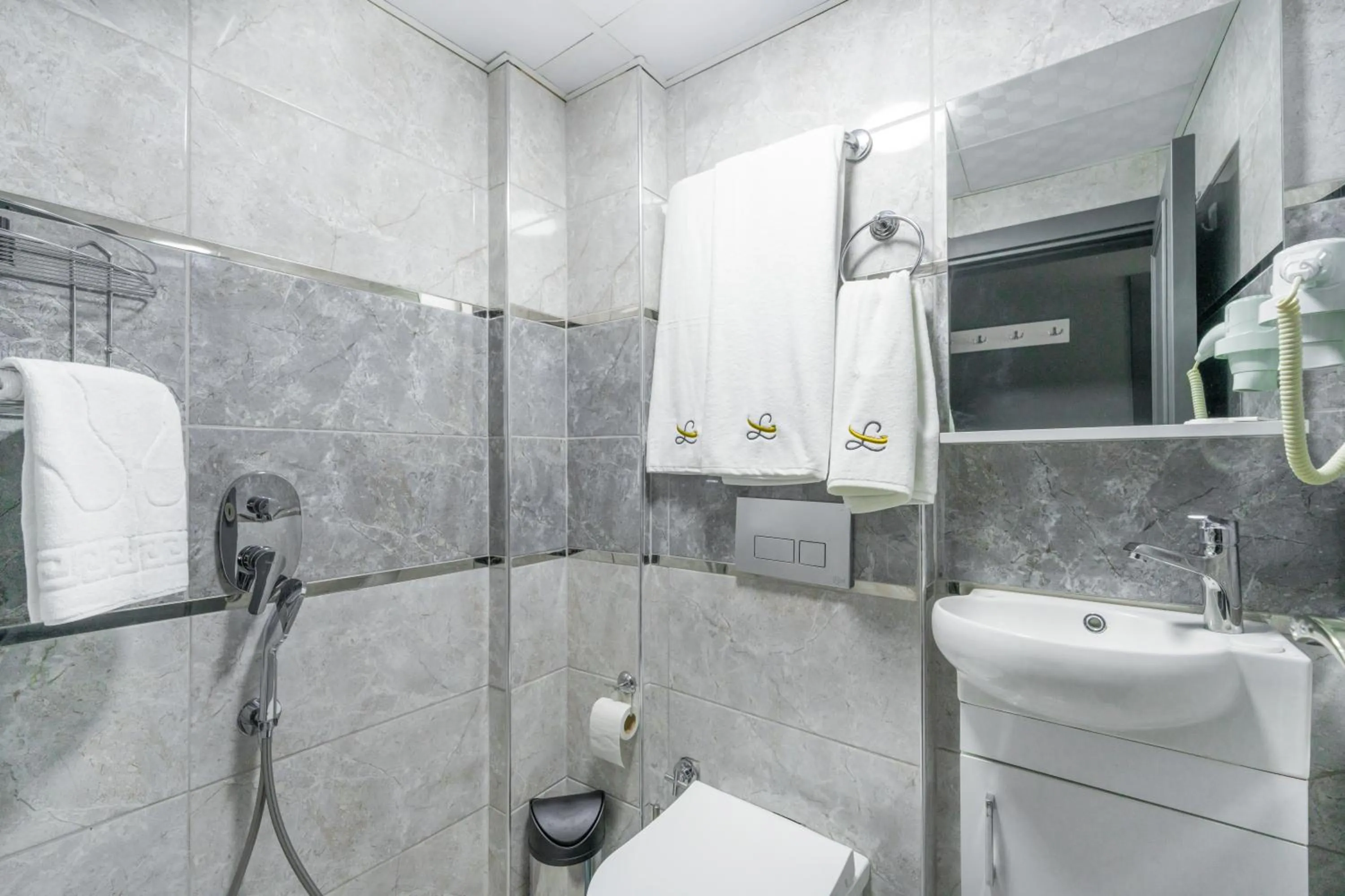 Toilet in OLSEN HOTELS