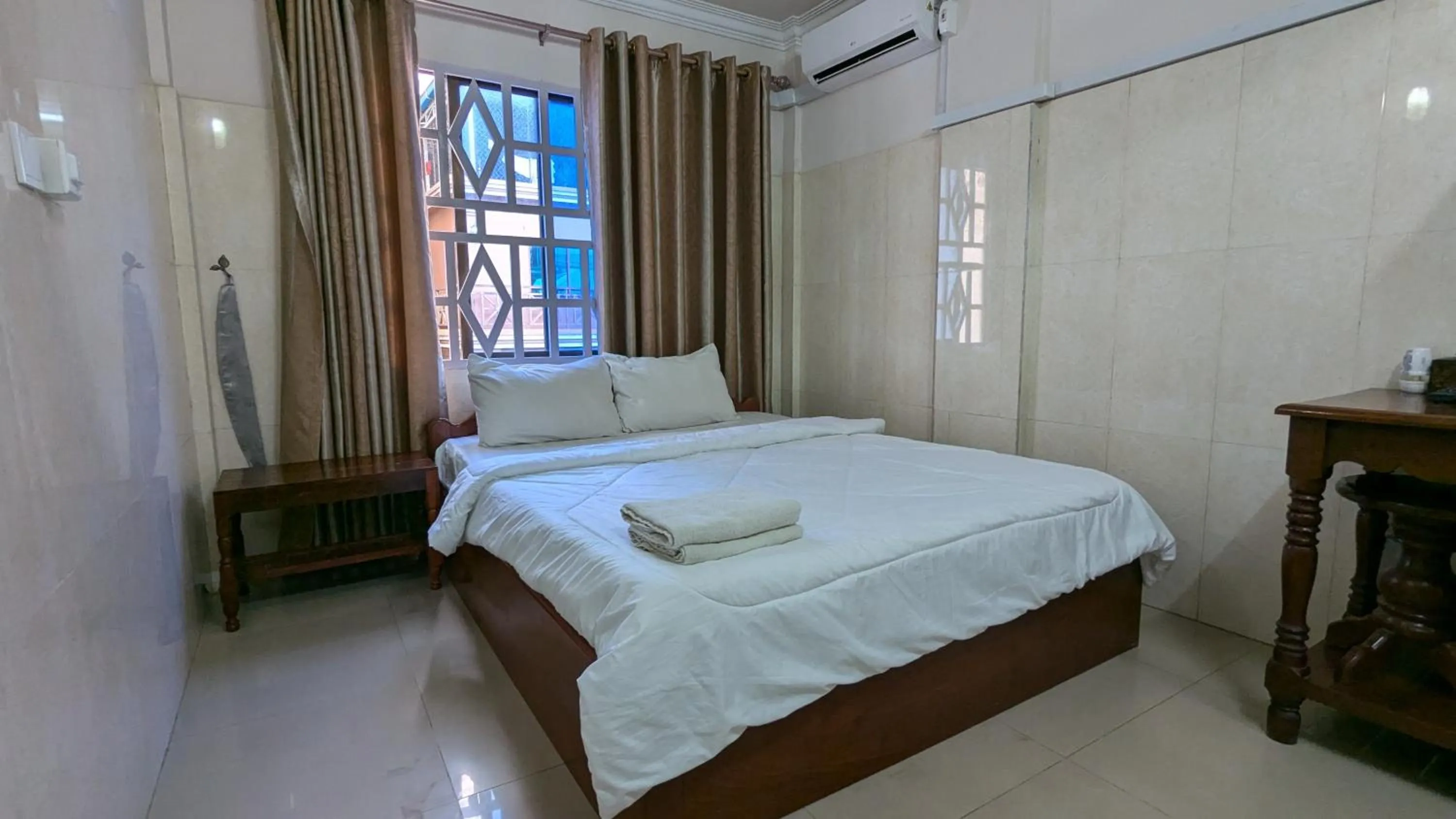 Bed in Empire House, Phnom Penh